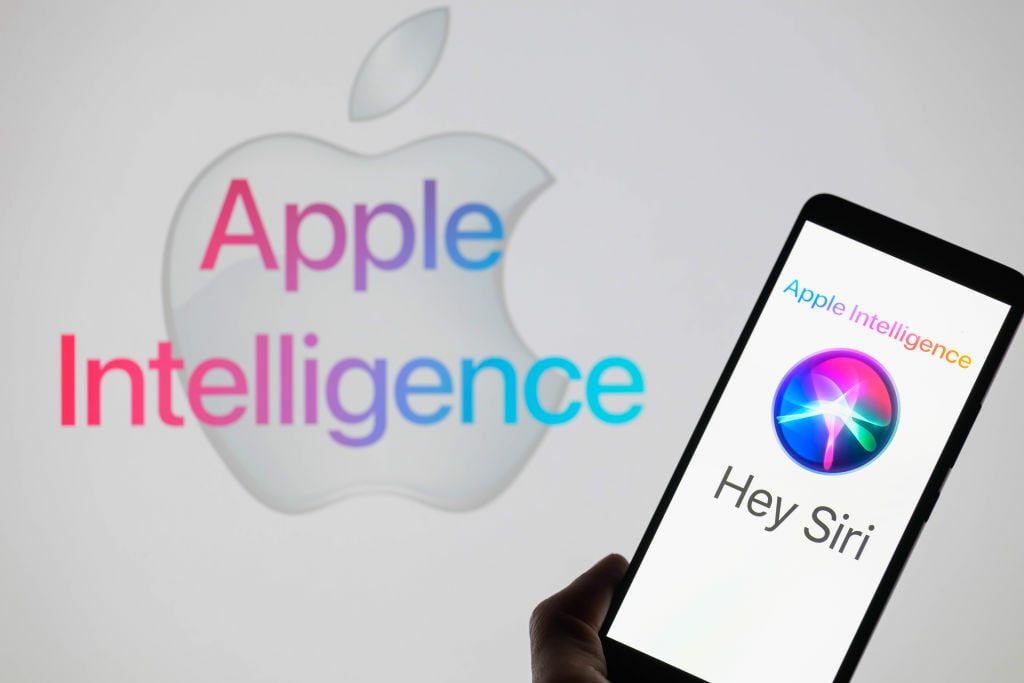 The Apple Siri AI icon displayed on a smartphone, with Apple Intelligence in the background