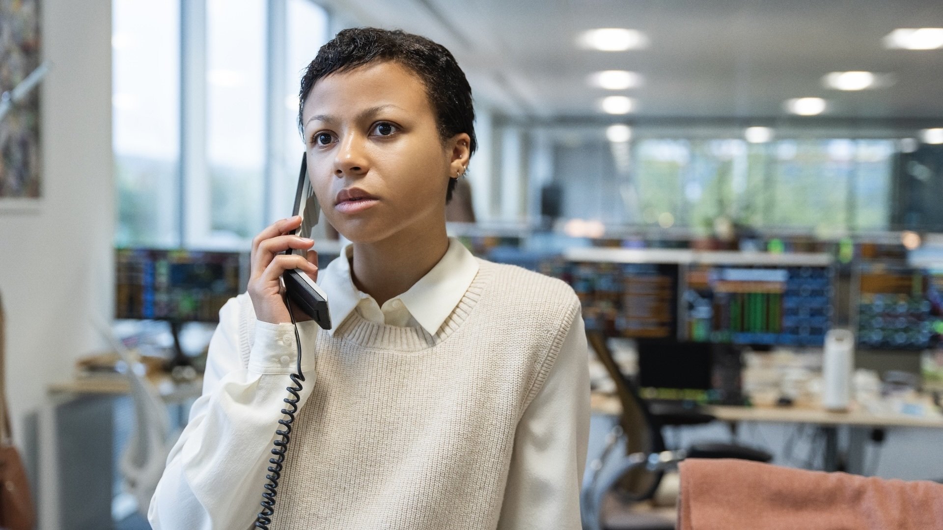 Harper Stern on the phone in an office.