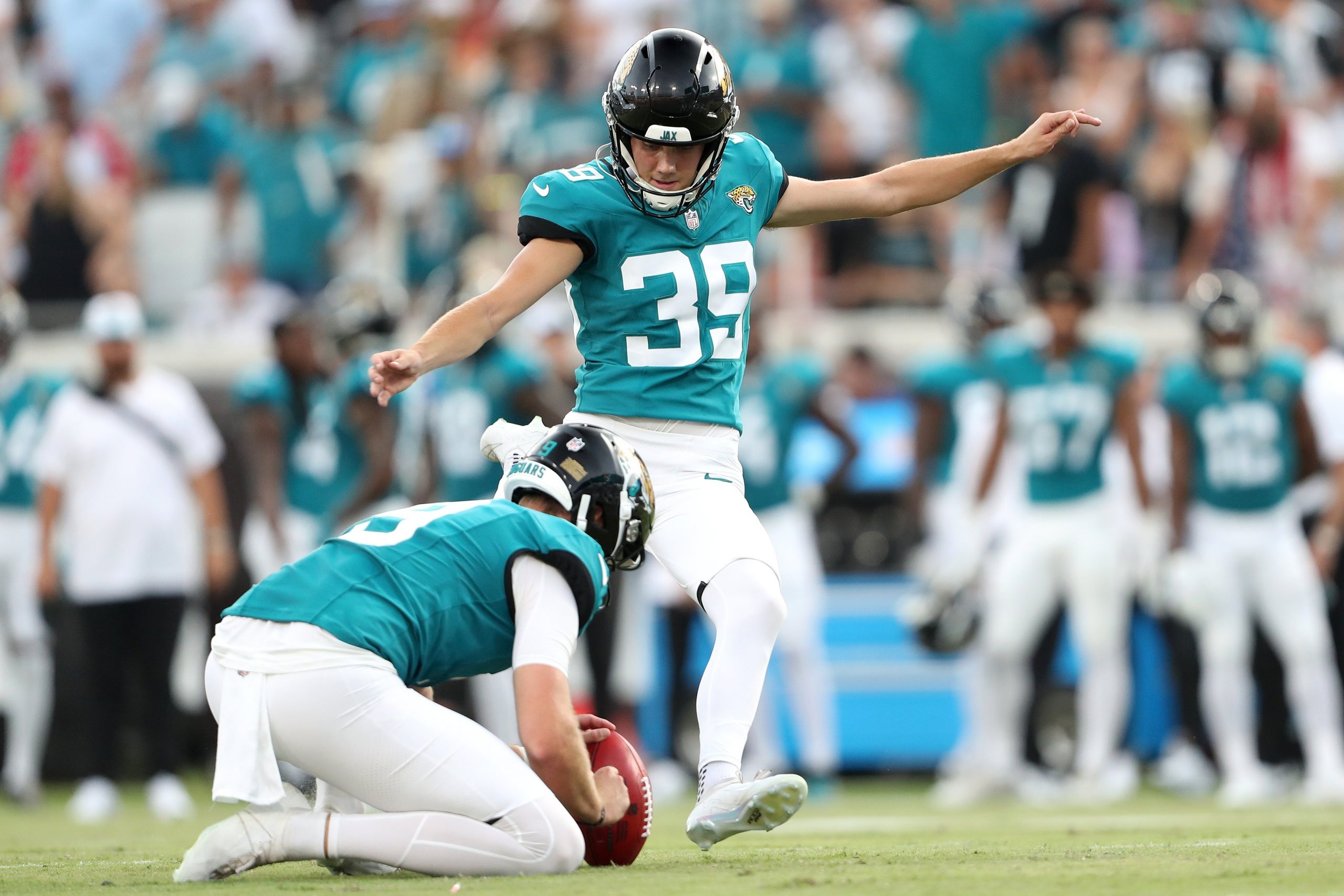 Cam Little of the Jacksonville Jaguars kicks an extra point