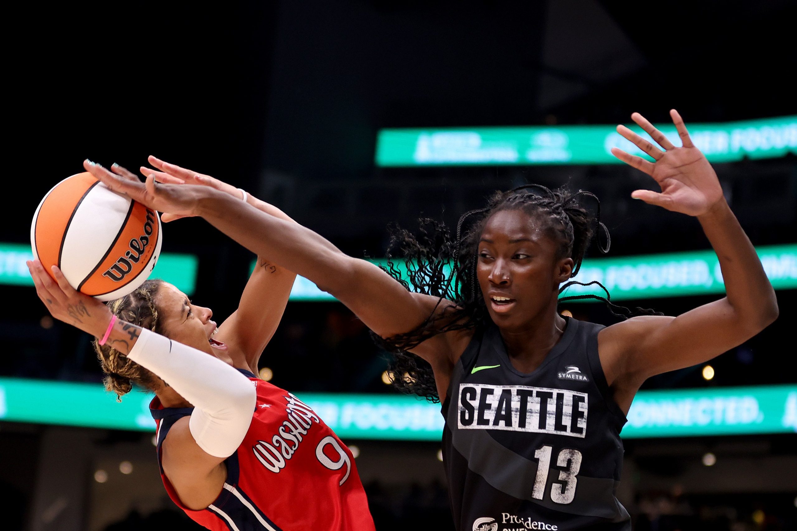 Ezi Magbegor #13 of the Seattle Storm blocks the shot of Natasha Cloud #9 of the Washington Mystics 