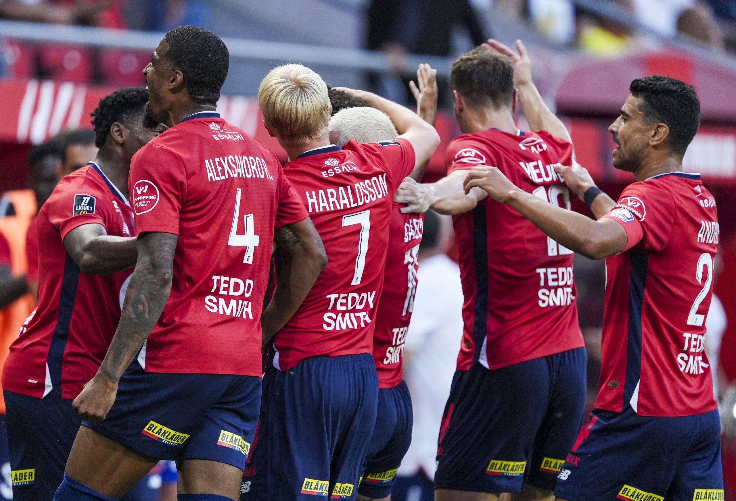 Players of Lille celebrate a goal