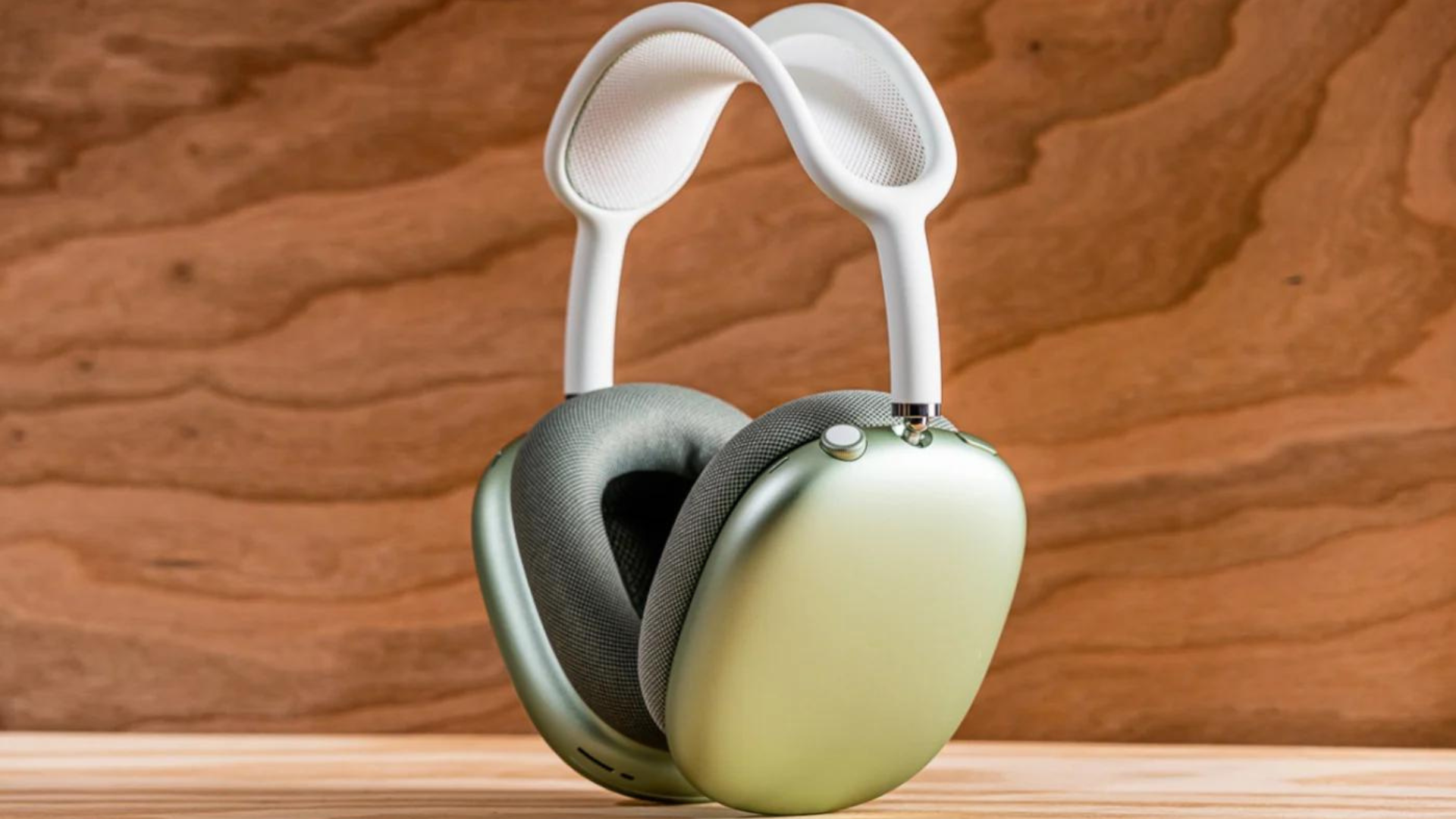 A pair of AirPods Max headphones in green