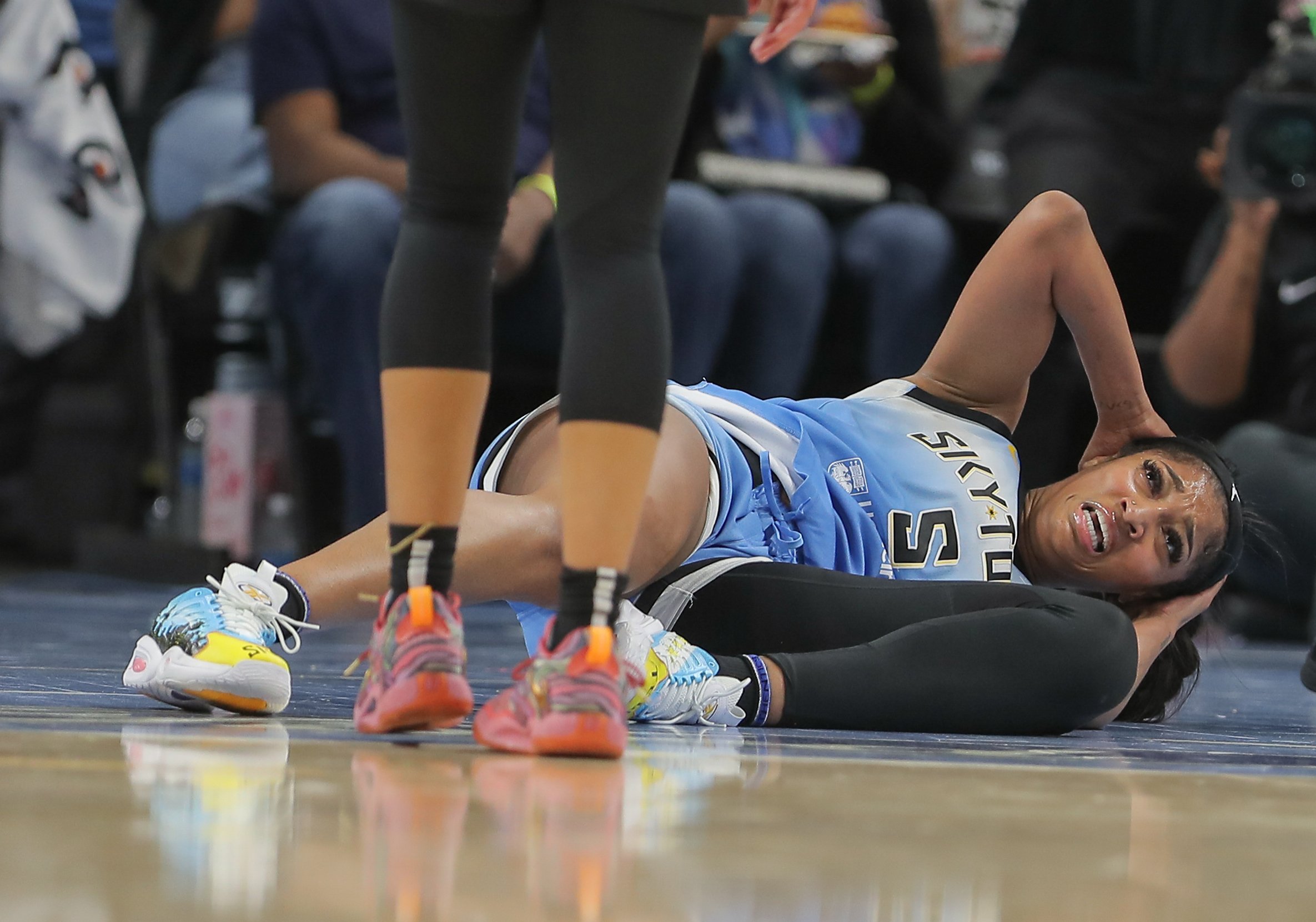  Angel Reese #5 of the Chicago Sky lays on the court 