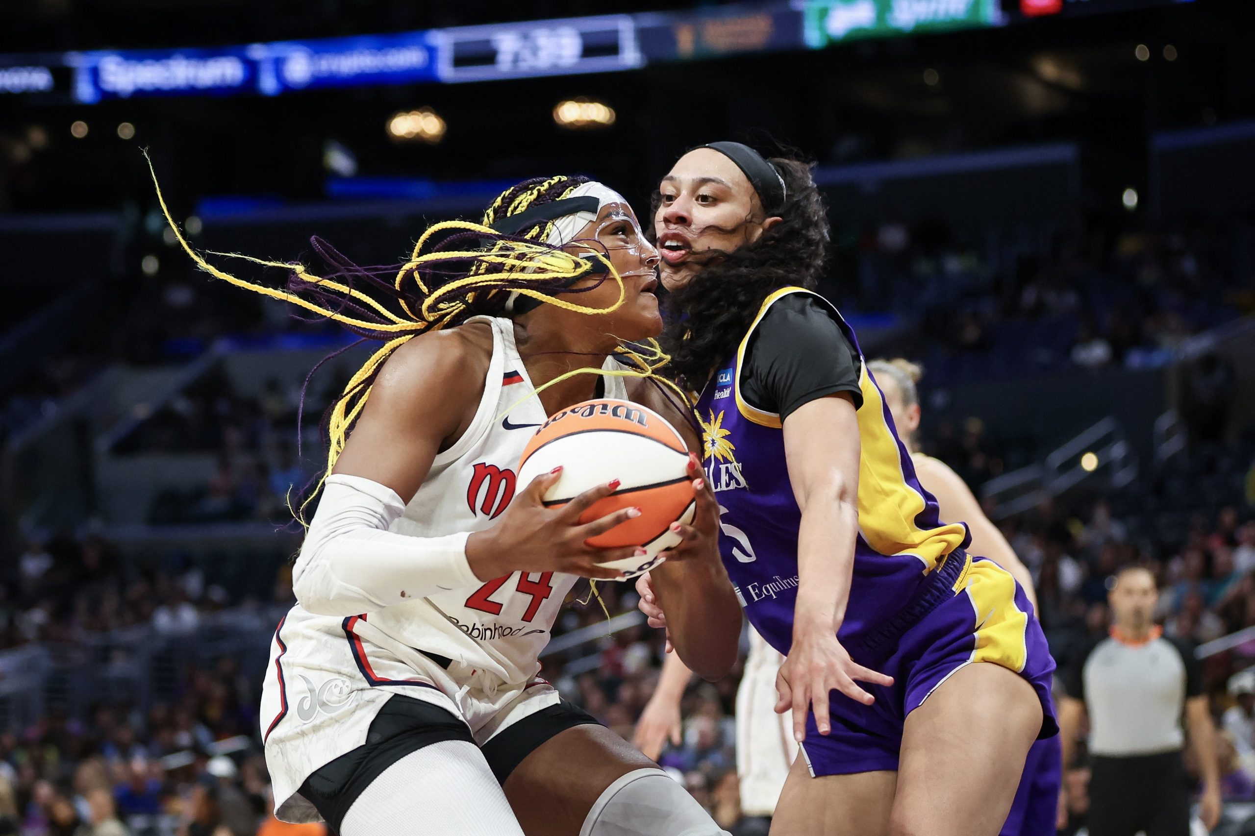 Aaliyah Edwards #24 of the Washington Mystics drives to the basket defended by Dearica Hamby #5 of the Los Angeles Spark