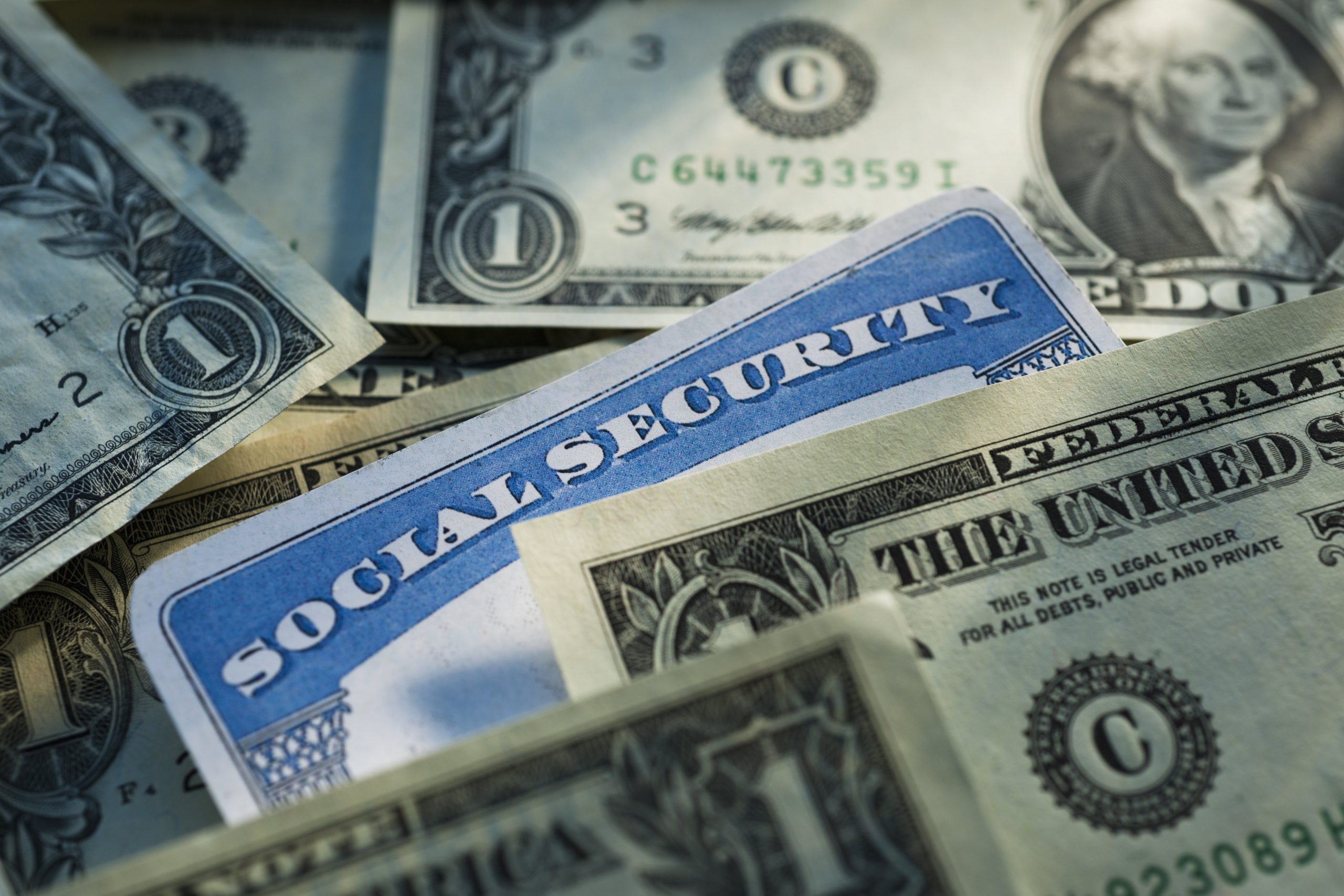 Studio shot of social security card and banknotes