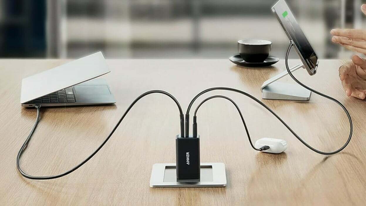 Anker charger on desk plugged into outlet