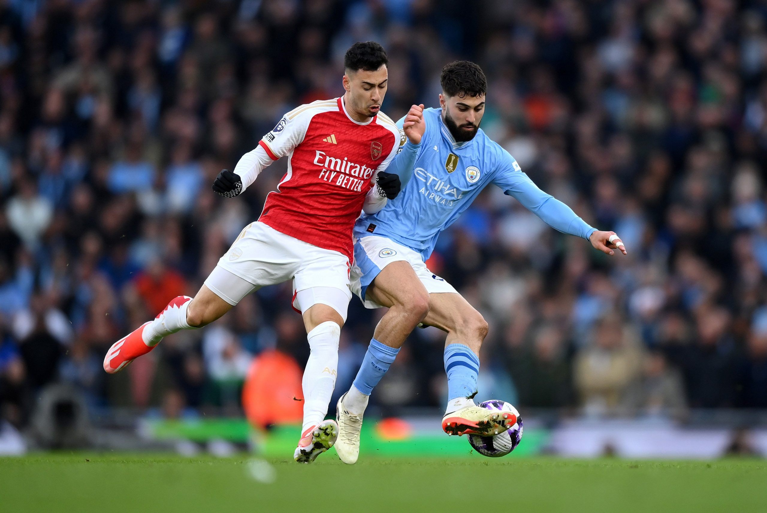 Josko Gvardiol of Manchester City is challenged by Gabriel Martinelli