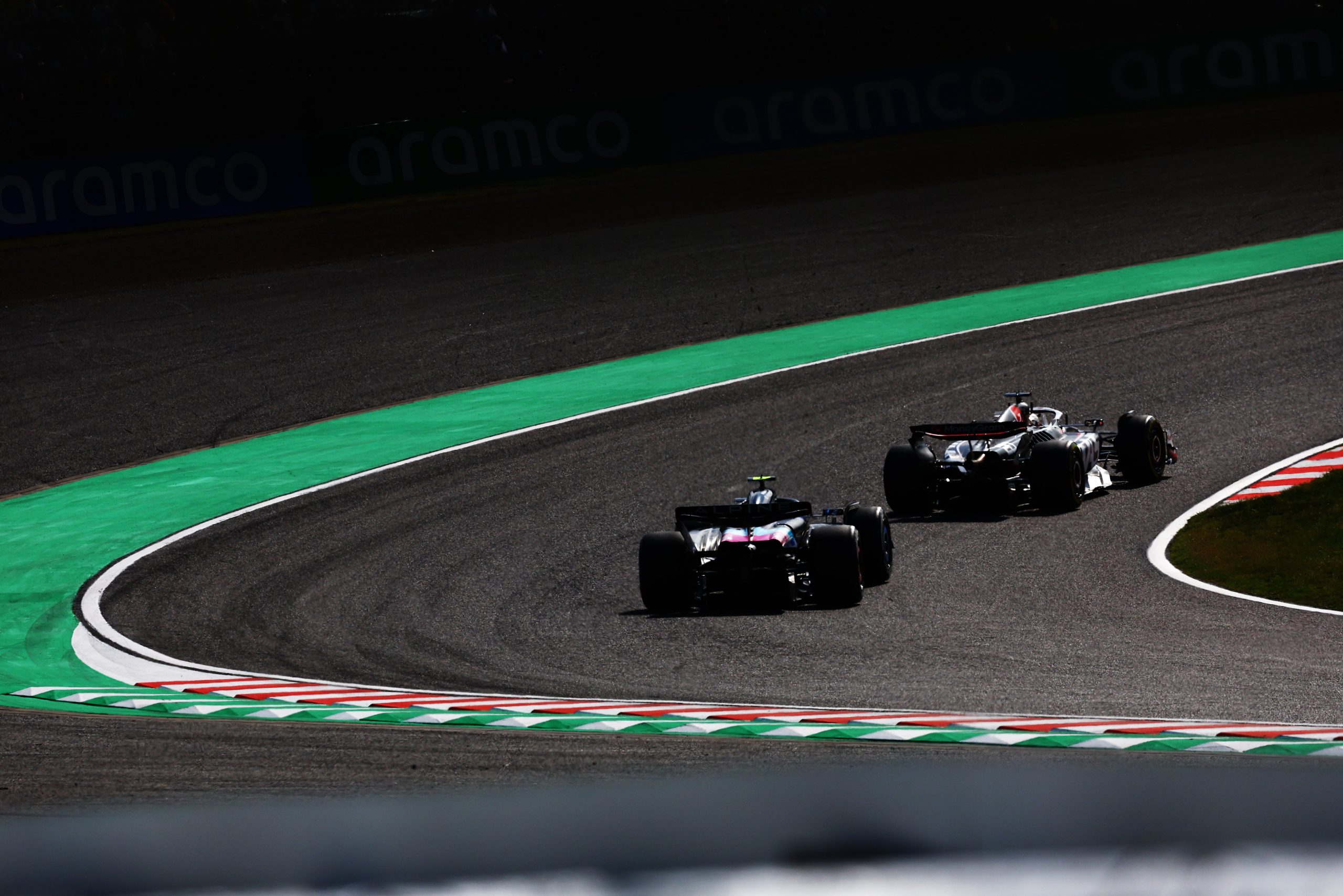 Kevin Magnussen of Denmark leads Pierre Gasly