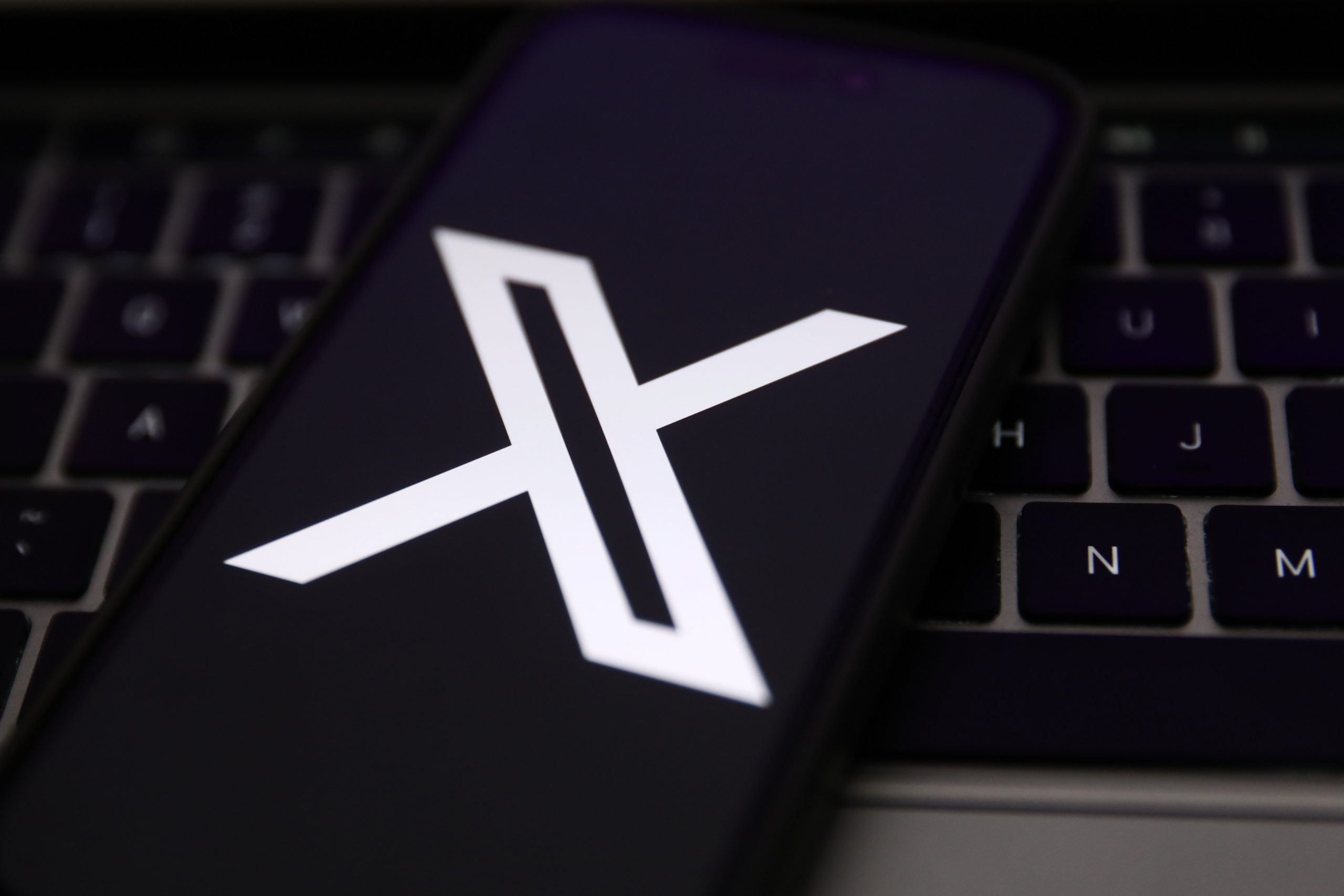 X logo on mobile device