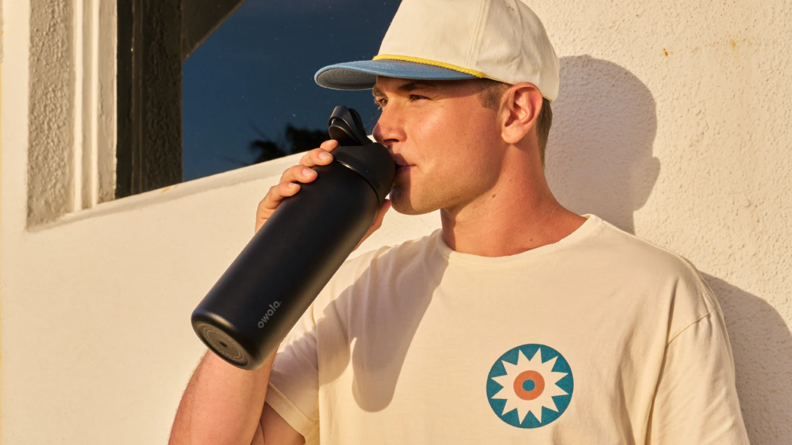 Man drinking out of Owala tumbler