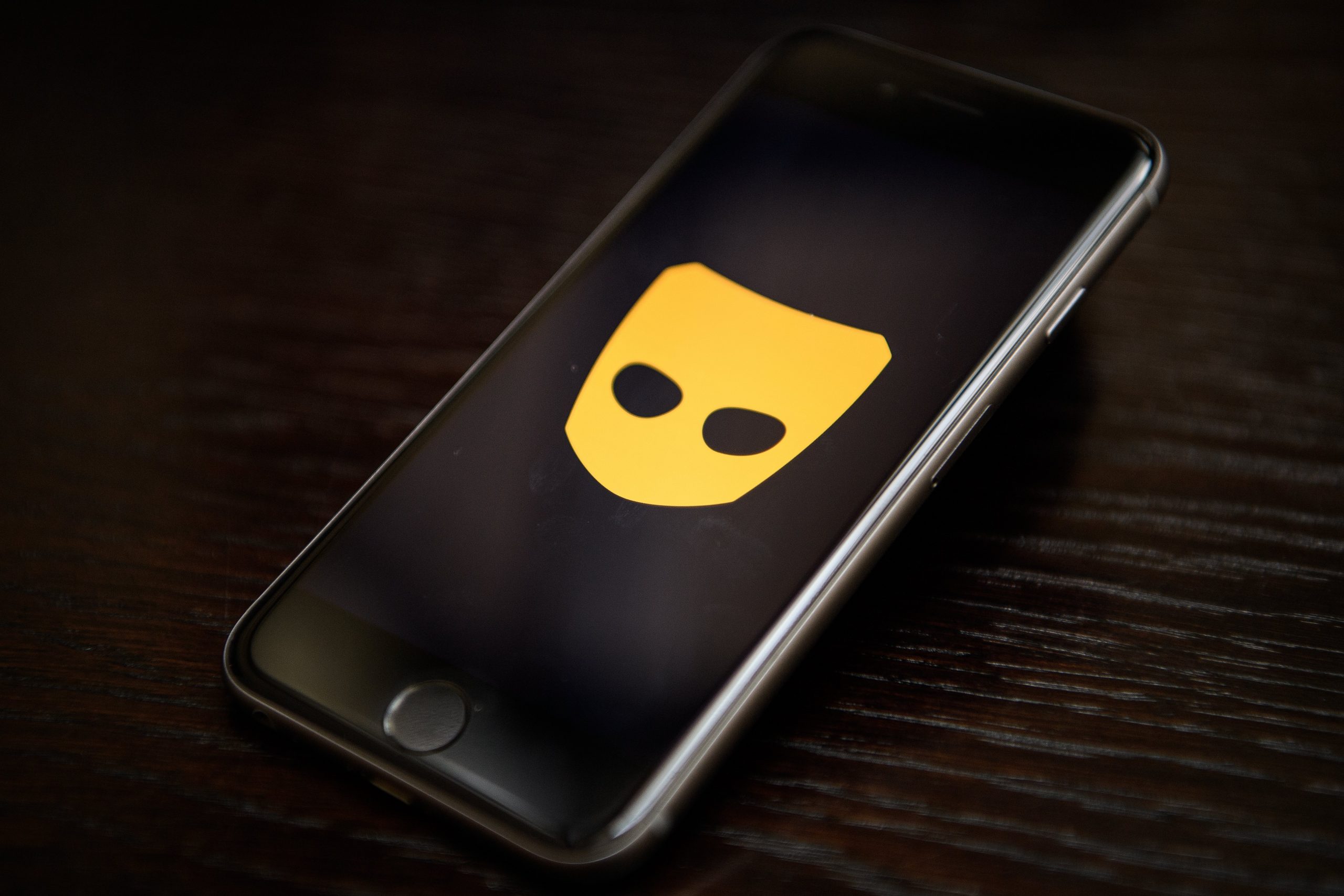 grindr logo on smartphone