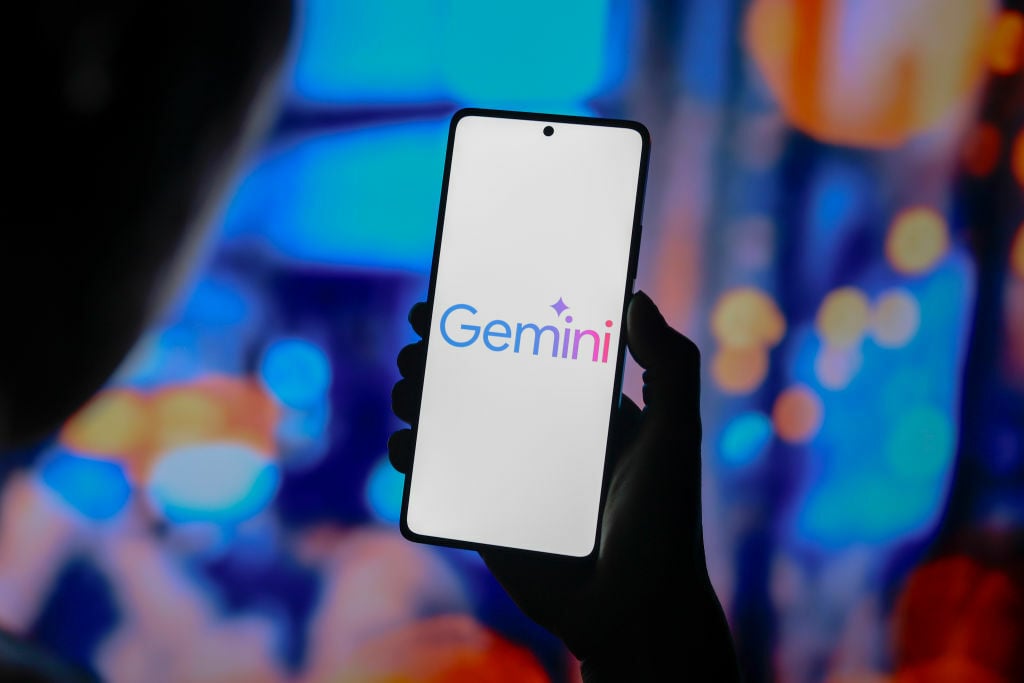 the Google Gemini logo is displayed on a smartphone screen