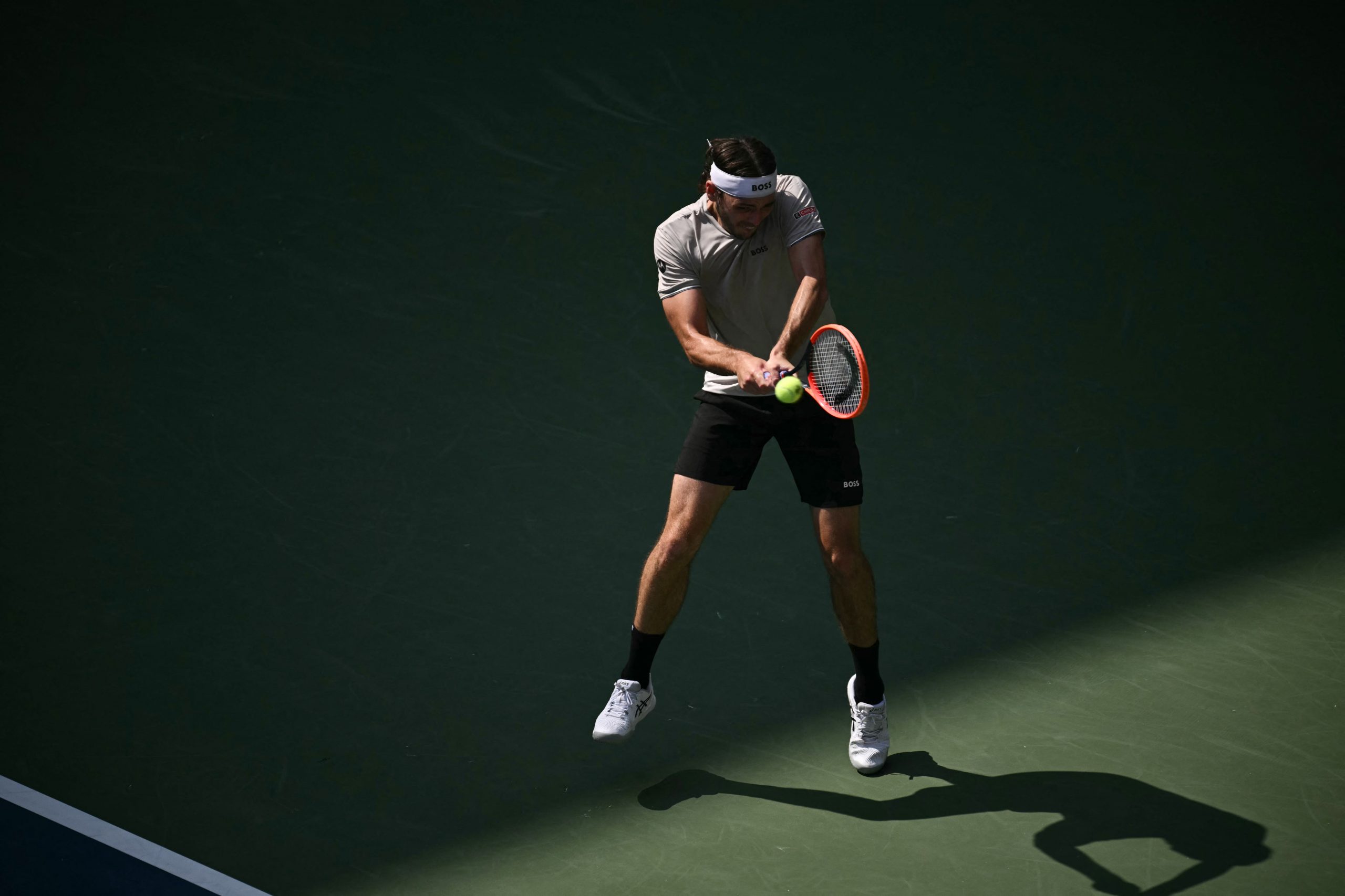 USA's Taylor Fritz hits a return