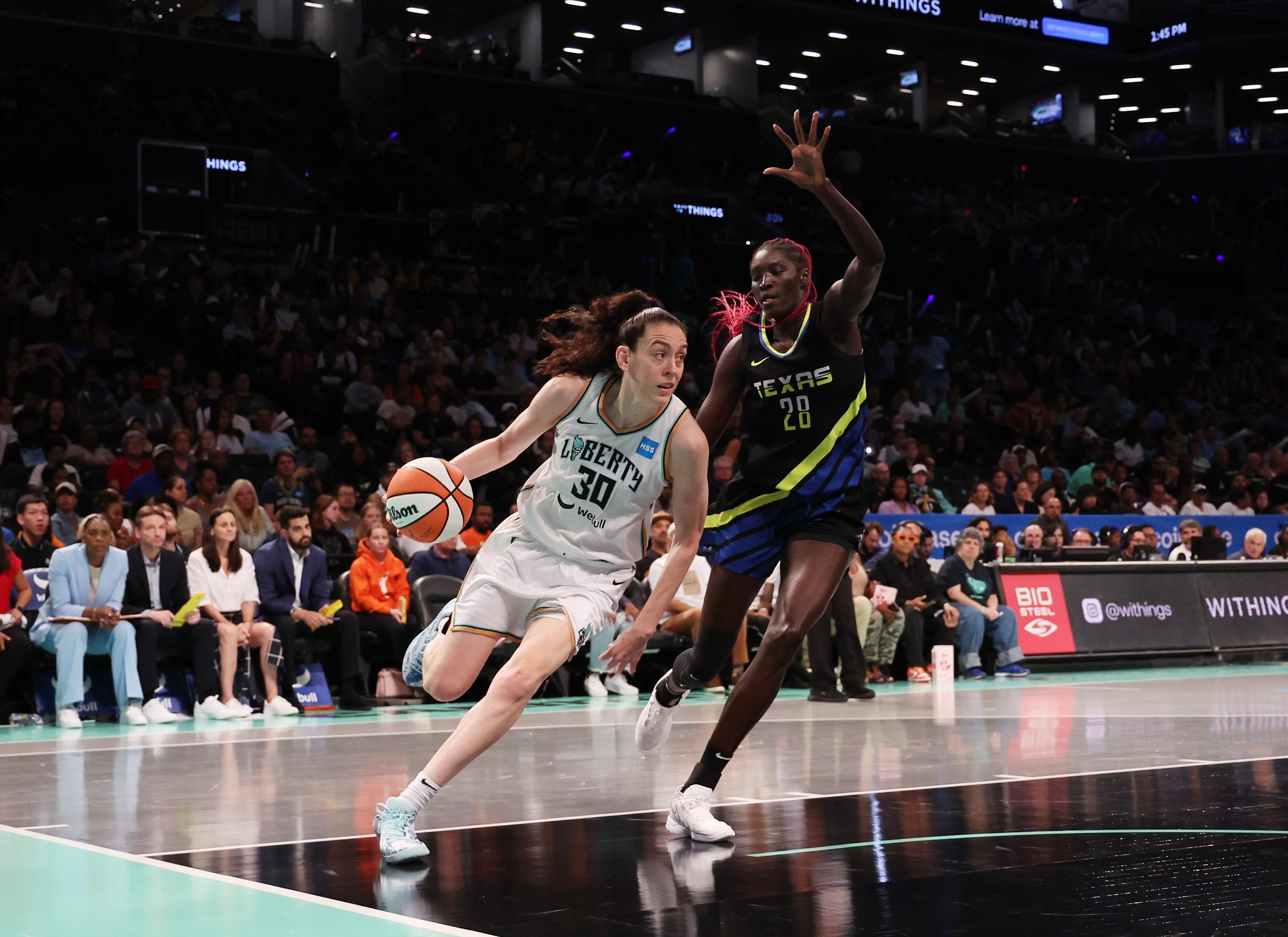 Breanna Stewart #30 of the New York Liberty in action against Awak Kuier #28 of the Dallas Wings