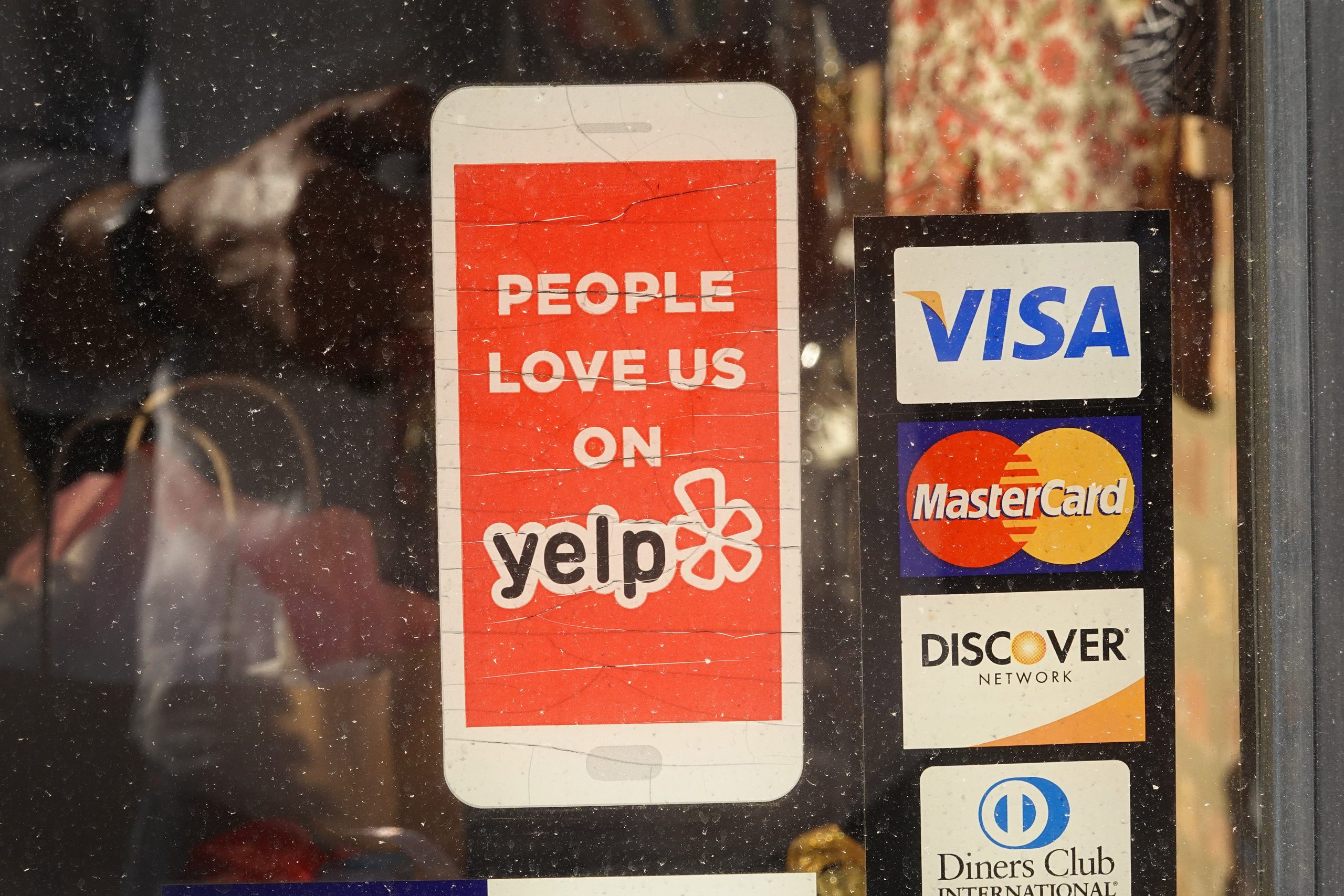 Yelp sticker on local business door