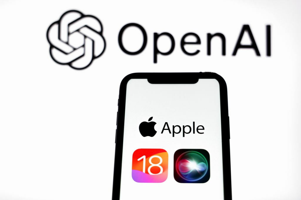 Apple iOS 18 logo seen displayed on an Apple iPhone with Open AI logo in the background