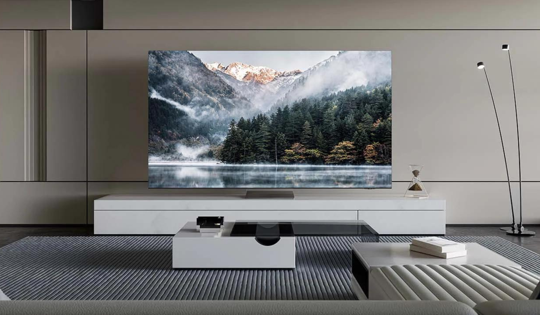 Samsung TV in living room setup with mountains and trees landscape on screen