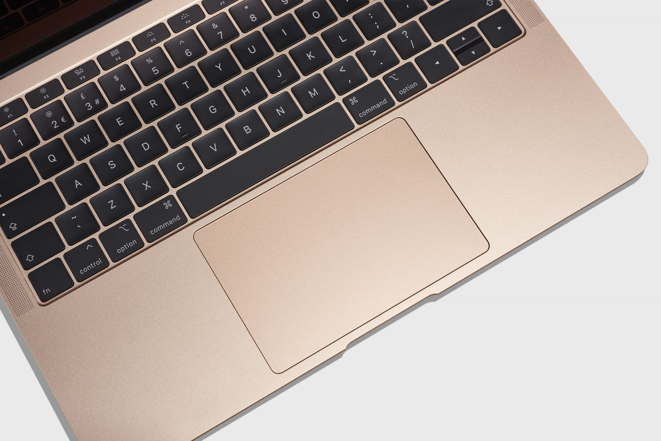 A rose gold 2018 Macbook that has the defective butterfly keyboard.