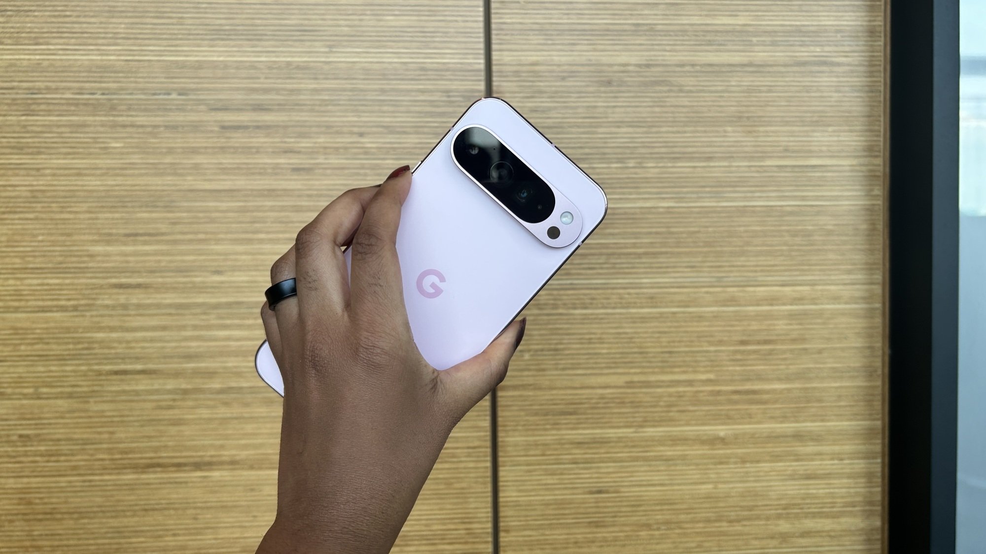 Woman holding Pixel 9 Pro XL chassis