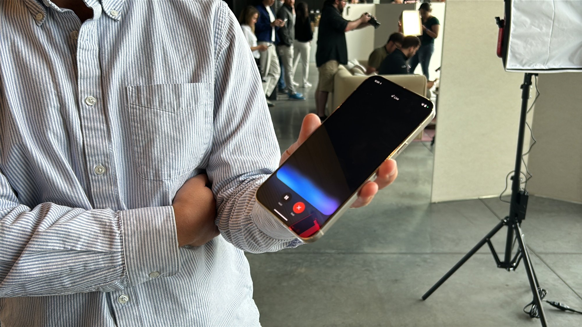 Man holding Pixel 9 series phone with Gemini Live