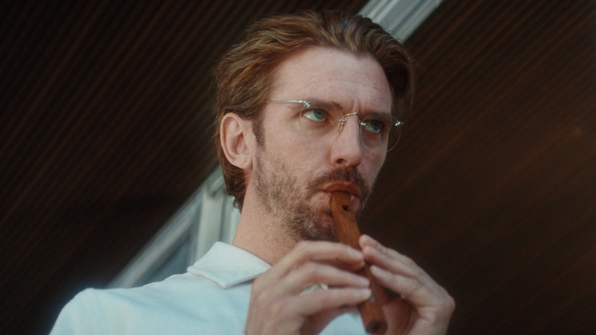 Dan Stevens plays a flute as Herr König in "Cuckoo."