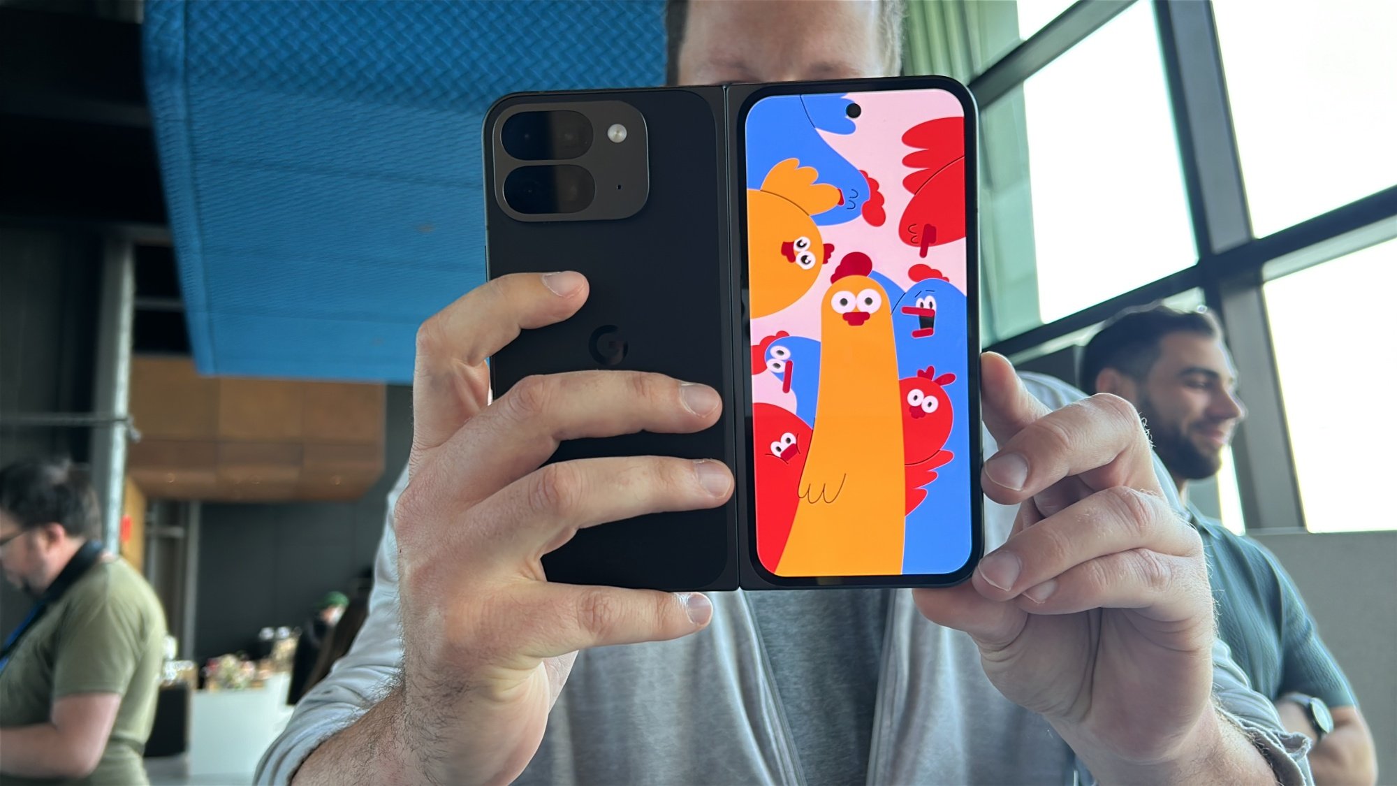 Google Pixel 9 Pro Fold showing an animated cartoon on the external screen