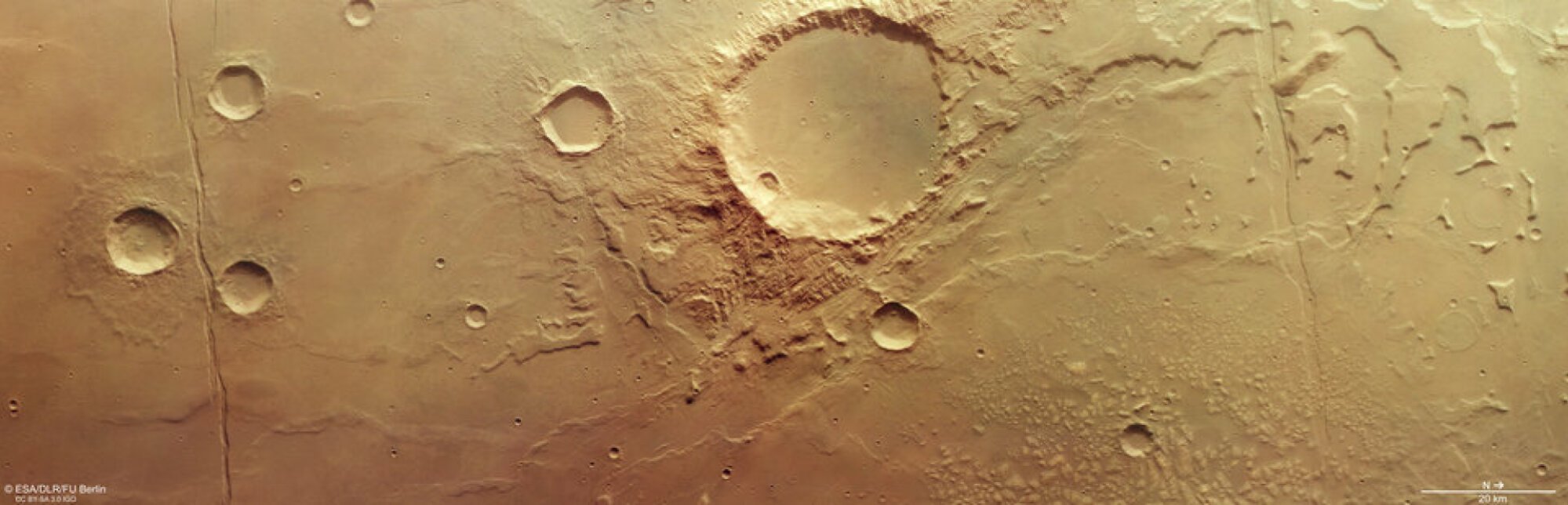 In this view of Mars' tan-colored surface, a map scale can be seen on the bottom right (20 km is about 12.5 miles).