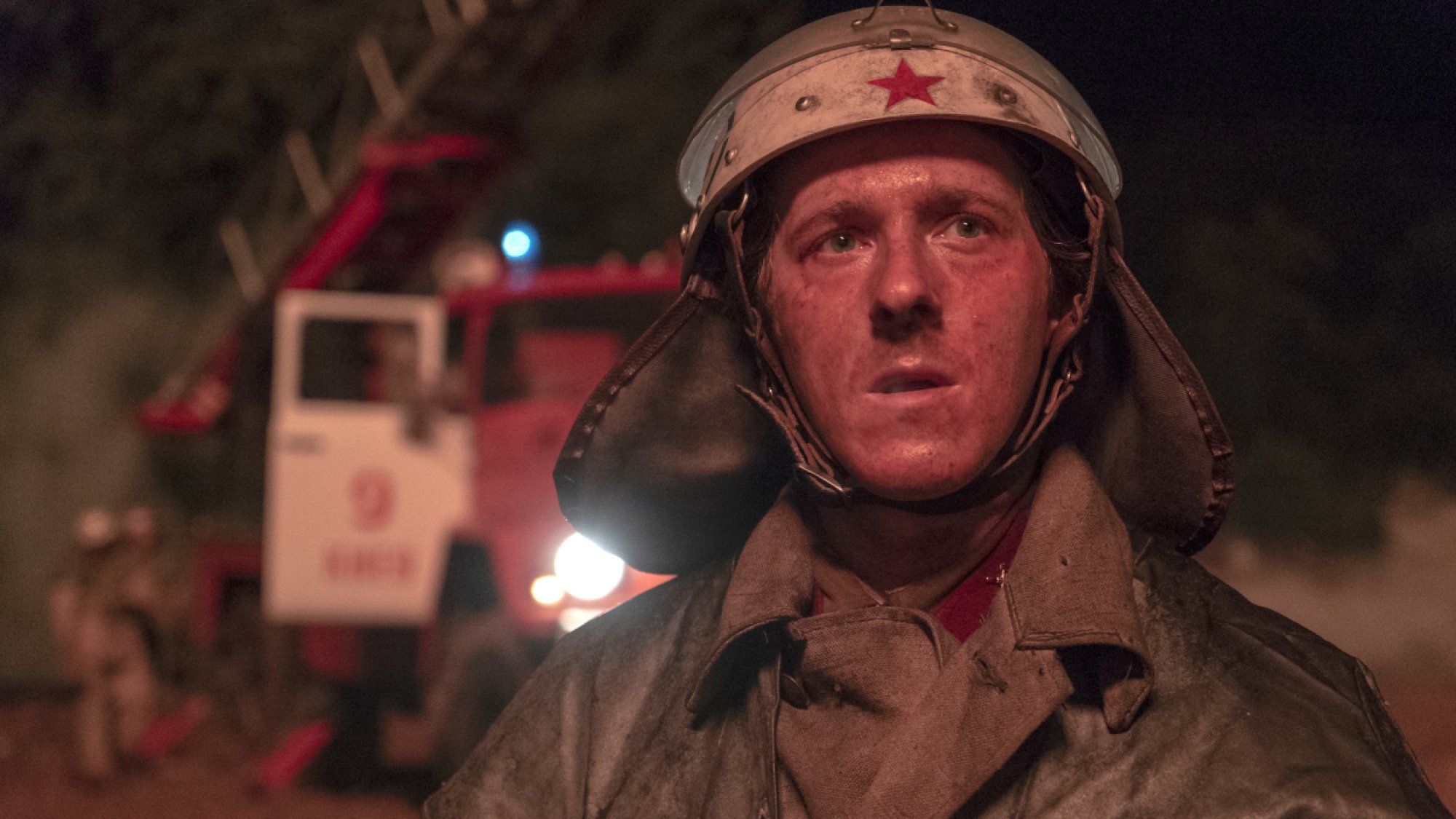 A rescue officer covered in dirt. 