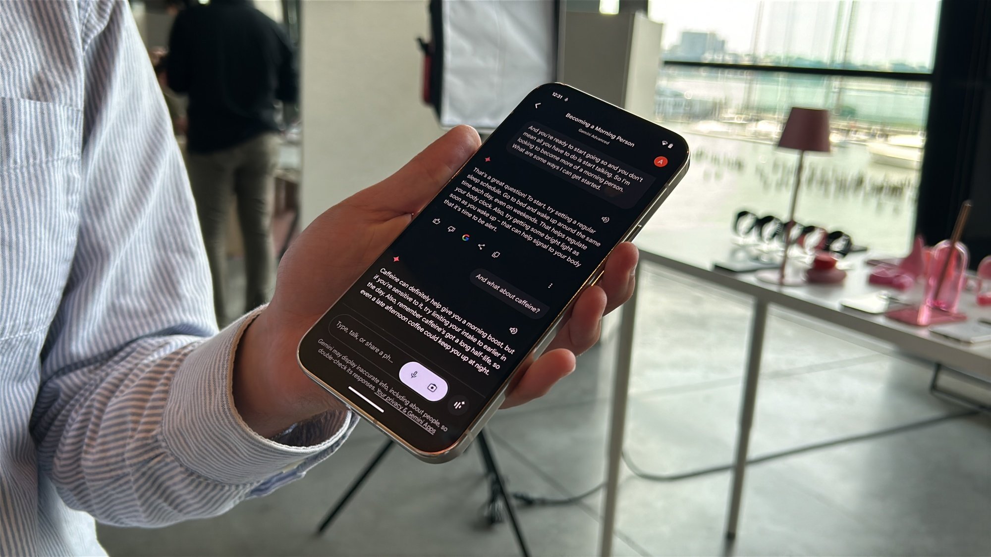 Man holding Pixel 9 series phone with Gemini Live