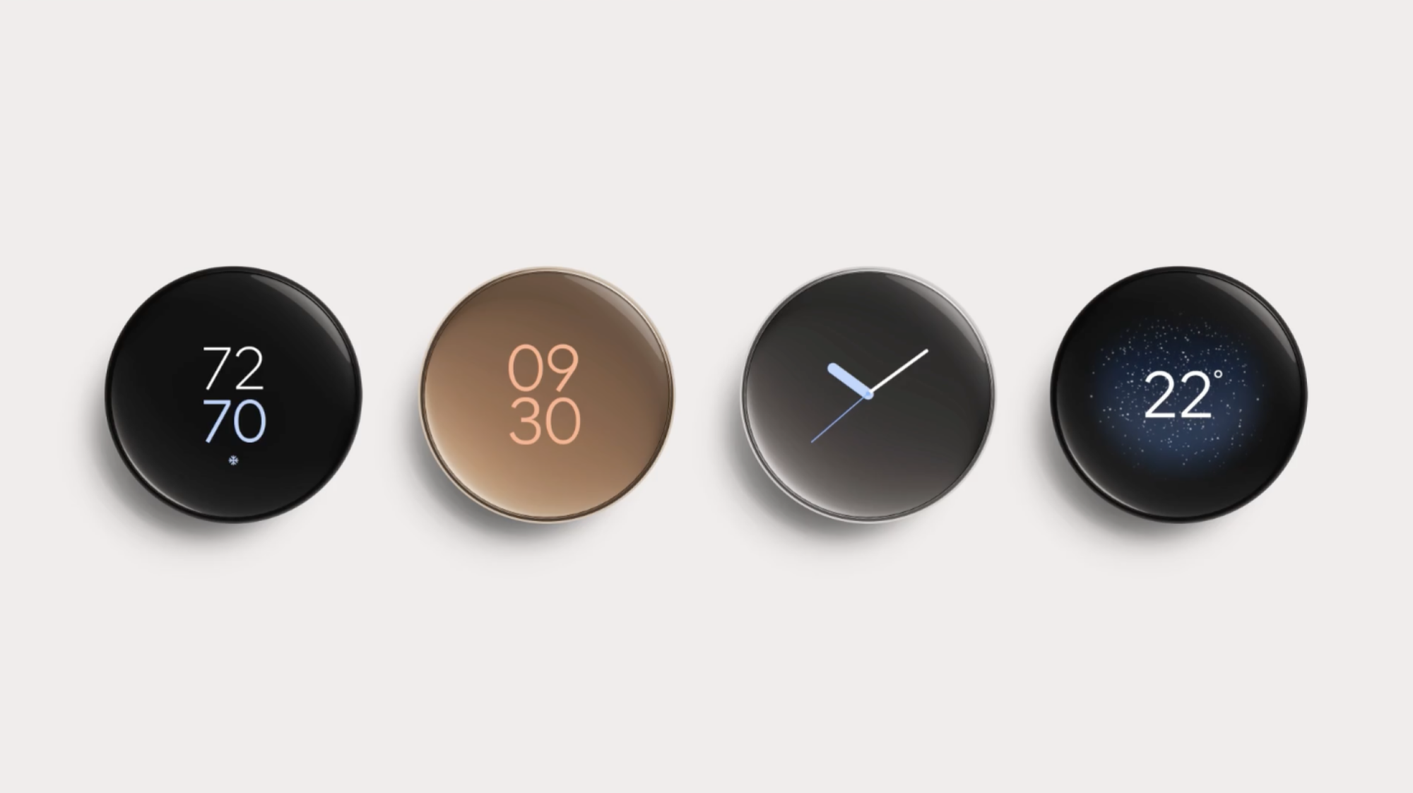 four fourth-gen google nest learning thermostats on a beige wall