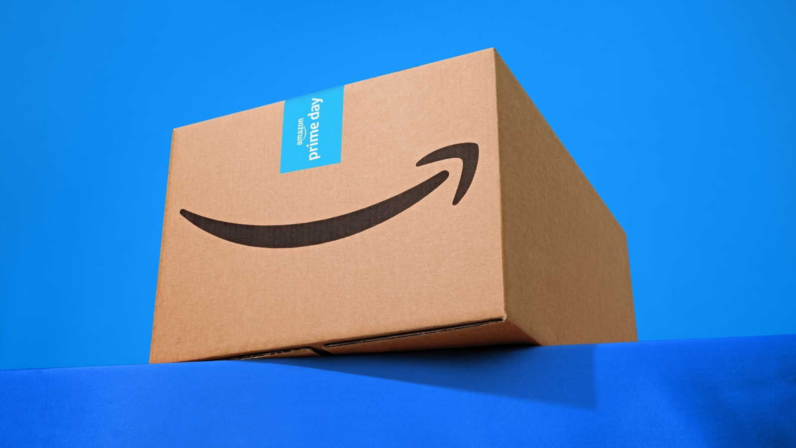 an amazon box against a bright blue background