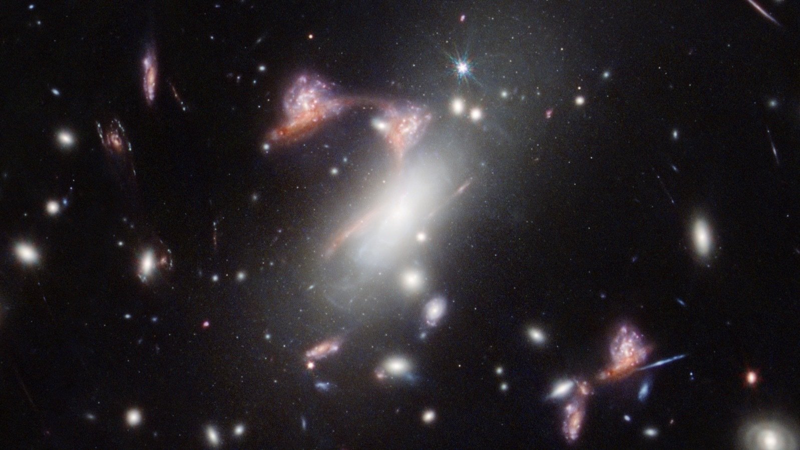 Gravitational lens distorting a galaxy cluster