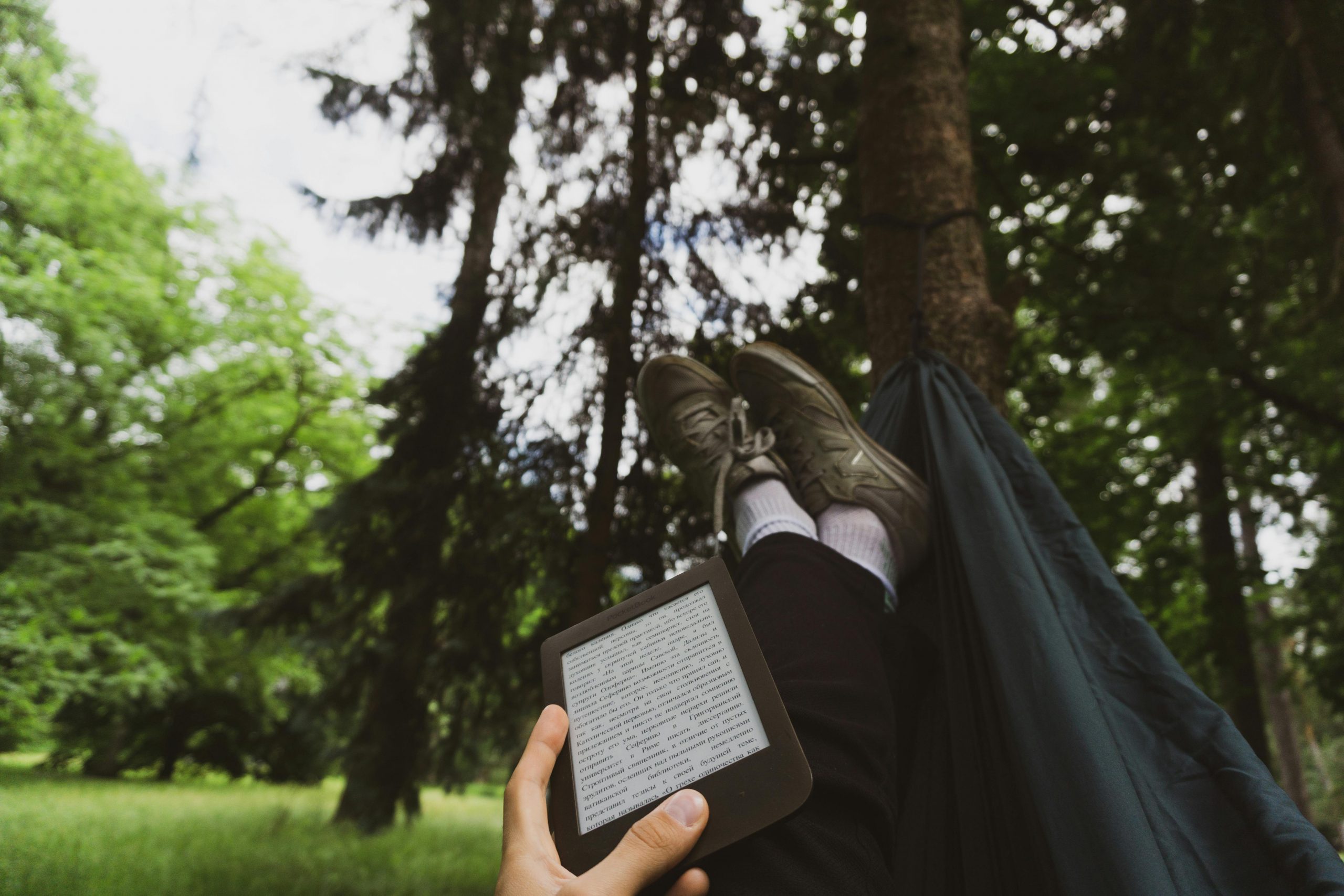 Kindle on lap in hammock