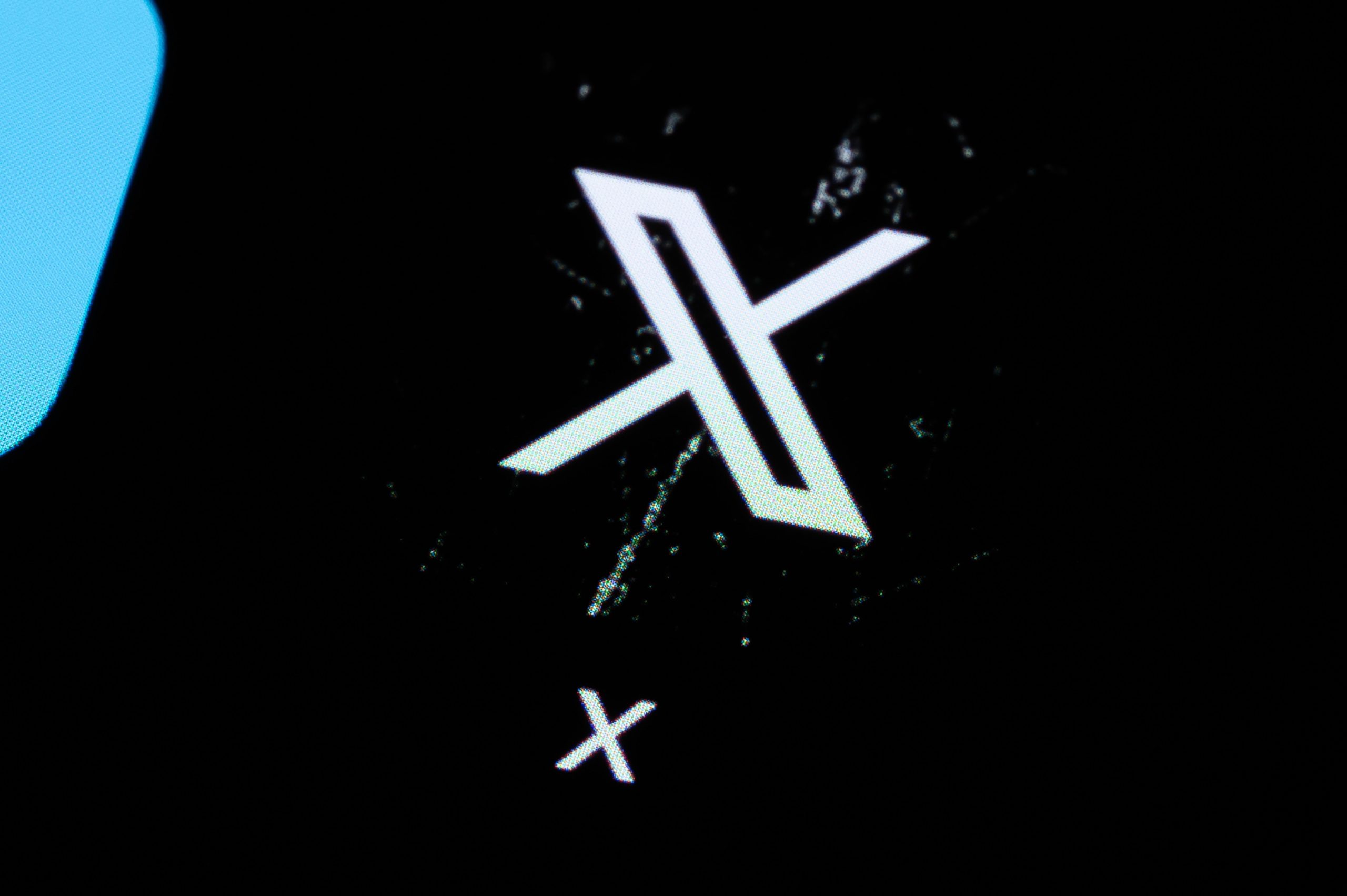 The X app. logo on a dark background.