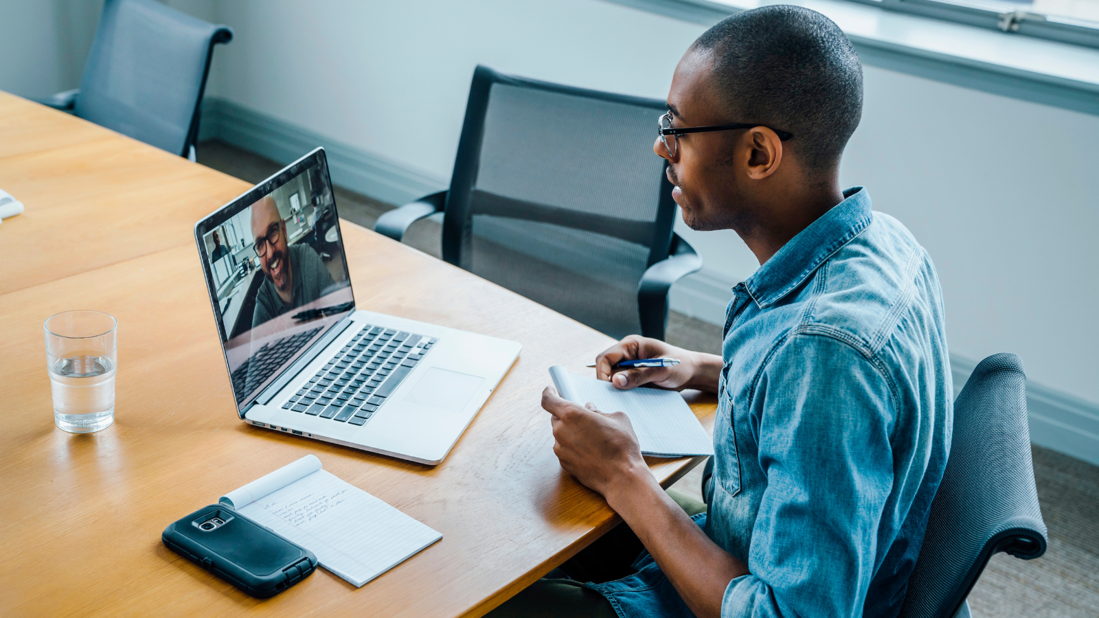 man video chatting with business professional