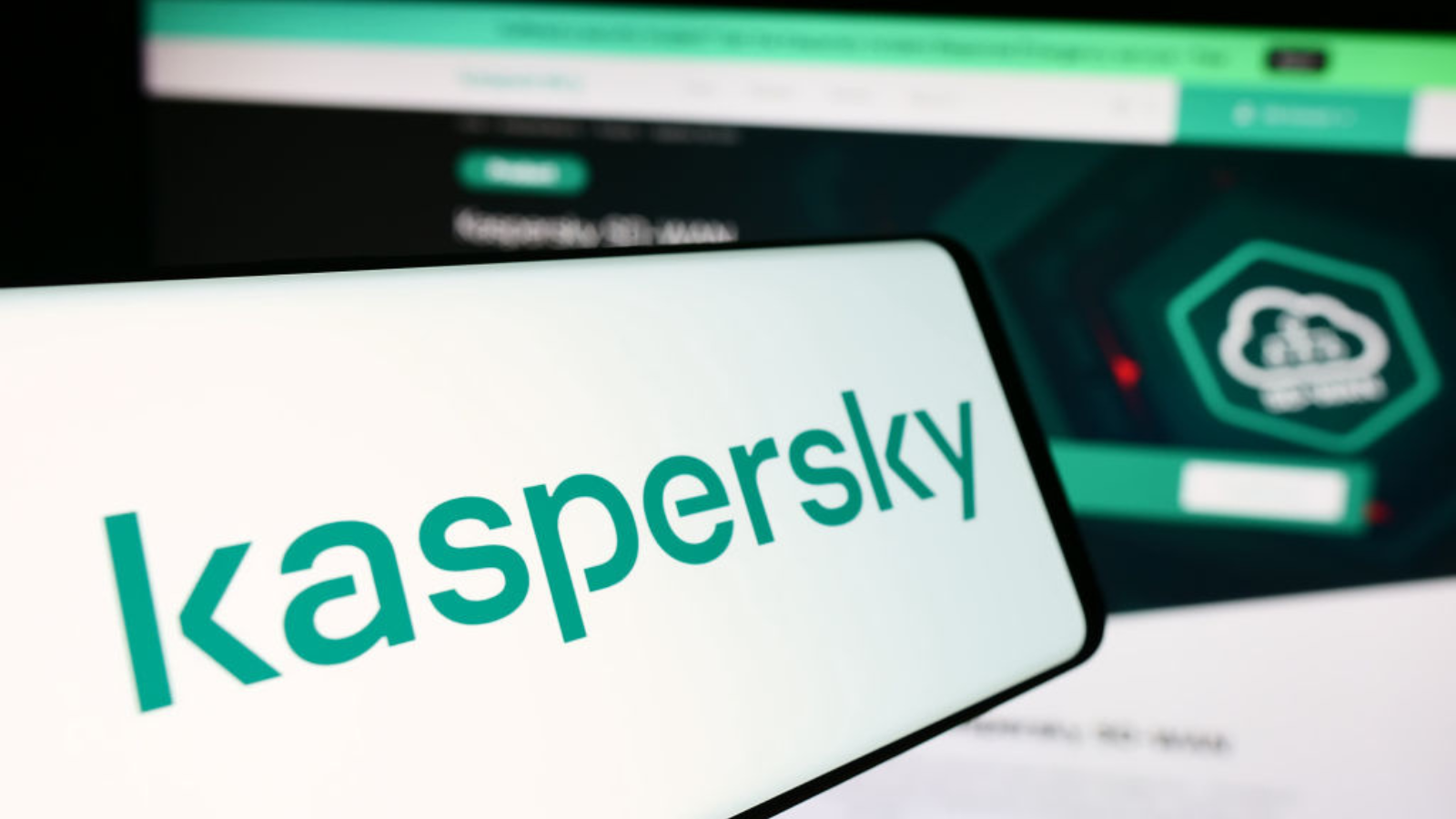 The Kaspersky logo on a mobile phone.