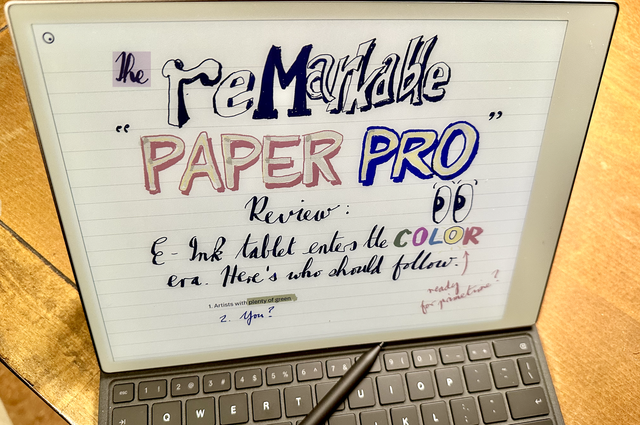 A Remarkable Paper Pro e-ink screen has a 'Remarkable Paper Pro' review written on it. 