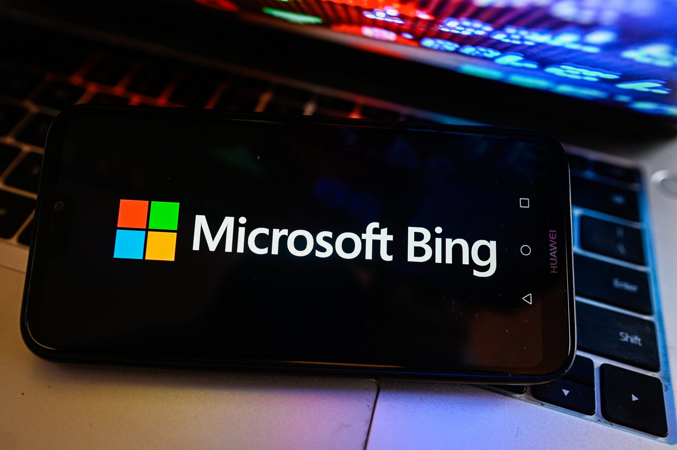 The Microsoft Bing logo on a dark phone screen.