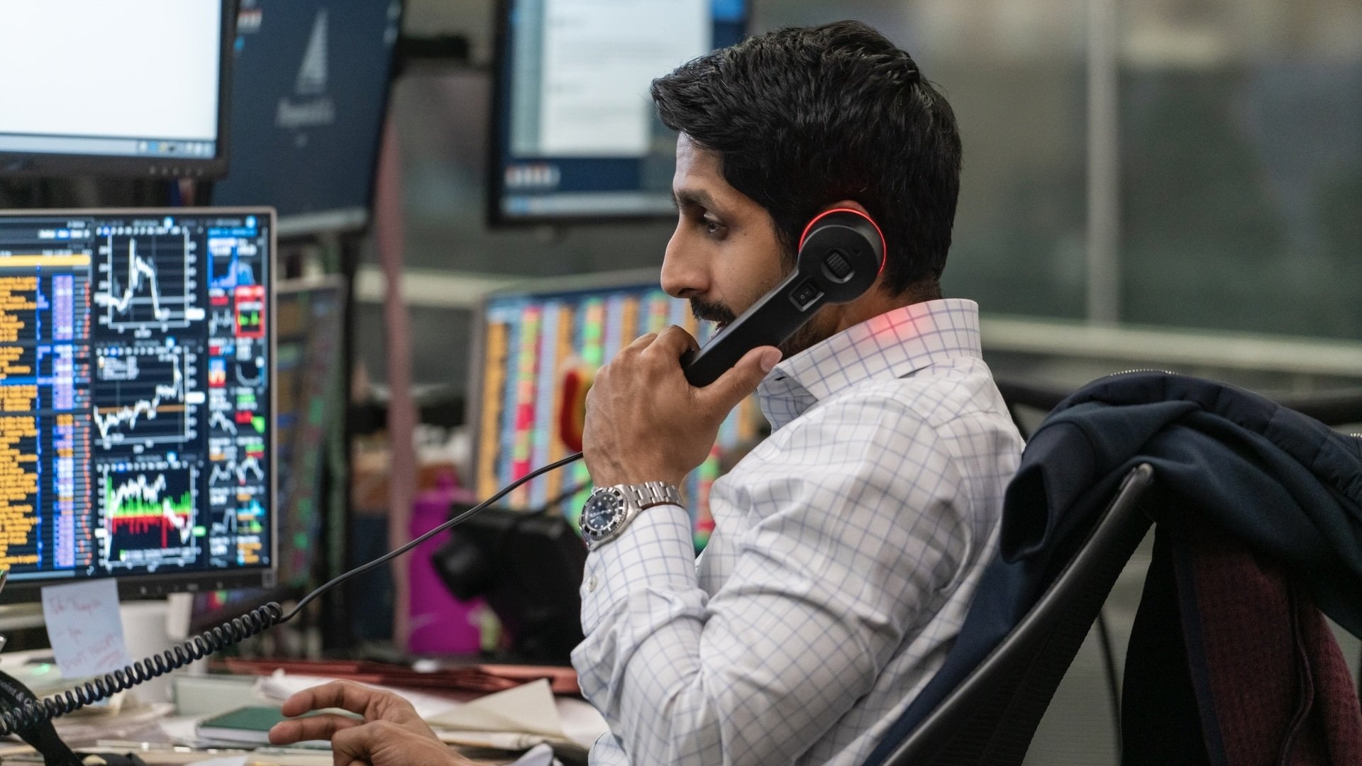 Rishi Ramdani takes a call at his desk.