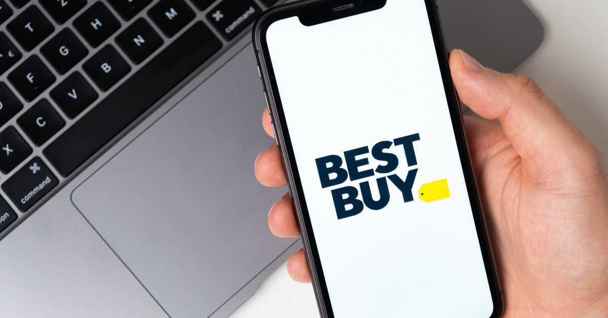 Best Buy the application is open in the smartphone. The man is holding a mobile phone in his hand, the company application is open on the screen. Secure online shopping. November 2021, San Francisco