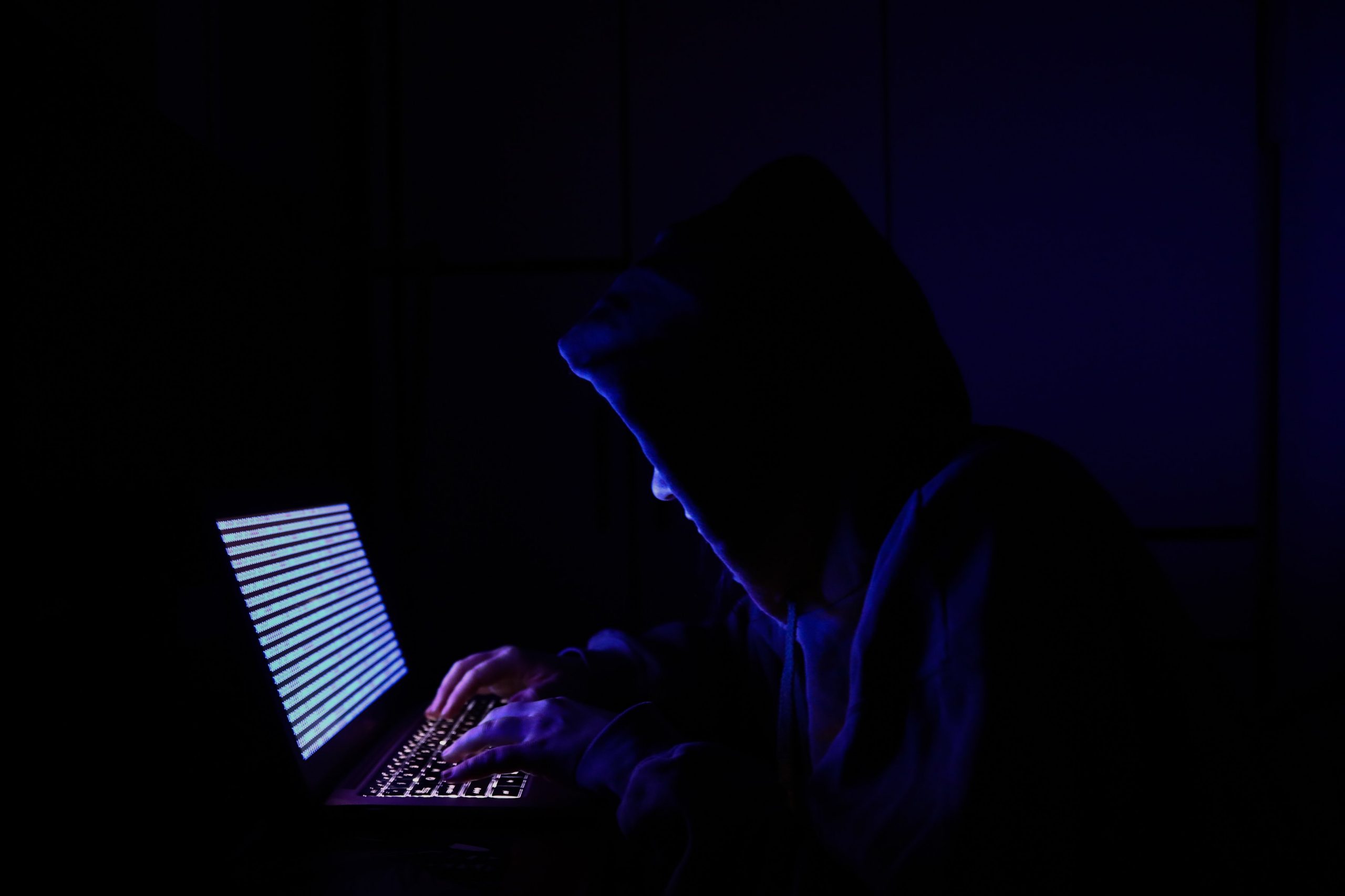 A person dressed as an internet hacker