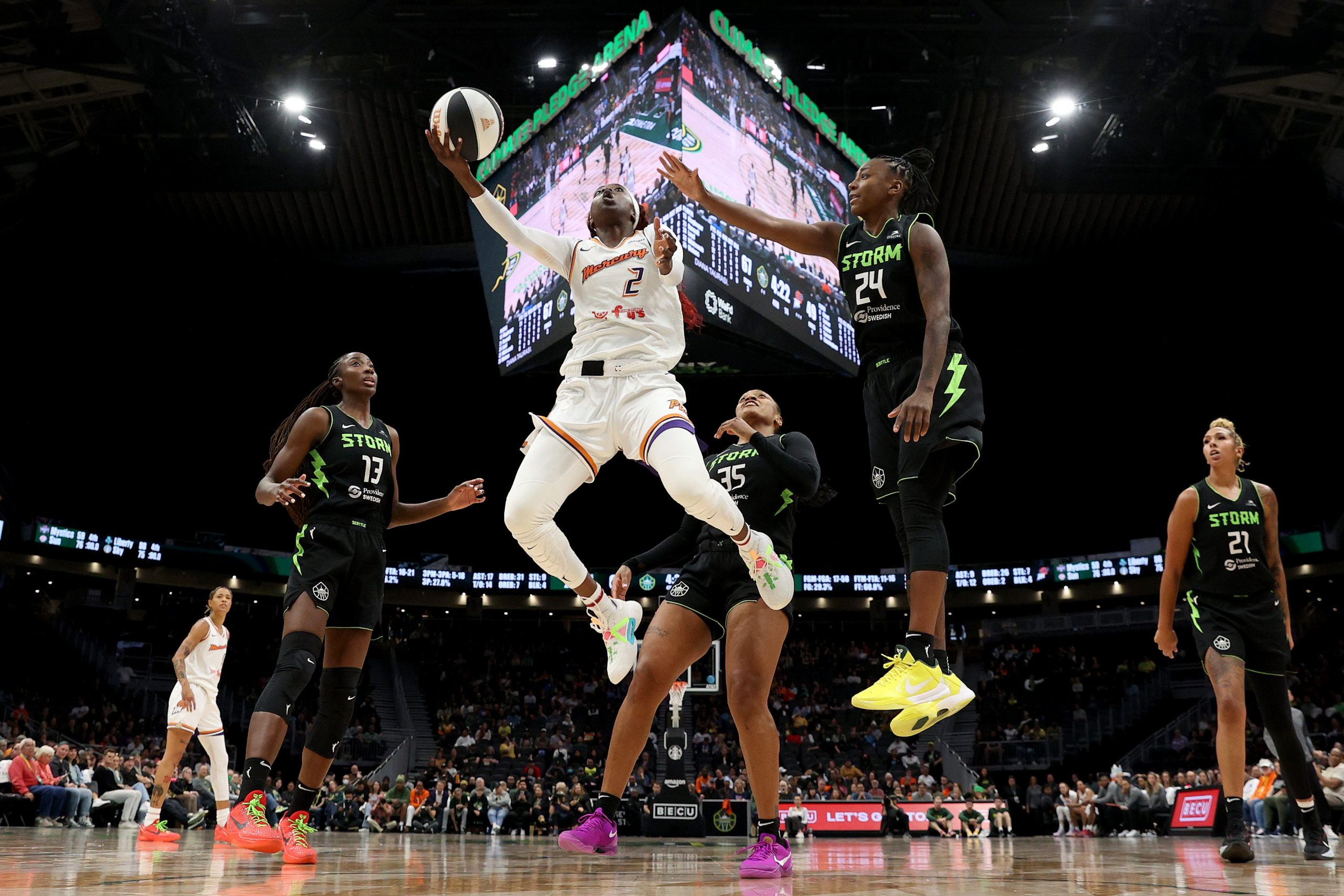 Kahleah Copper of the Phoenix Mercury shoots against Jewell Loyd of the Seattle Storm