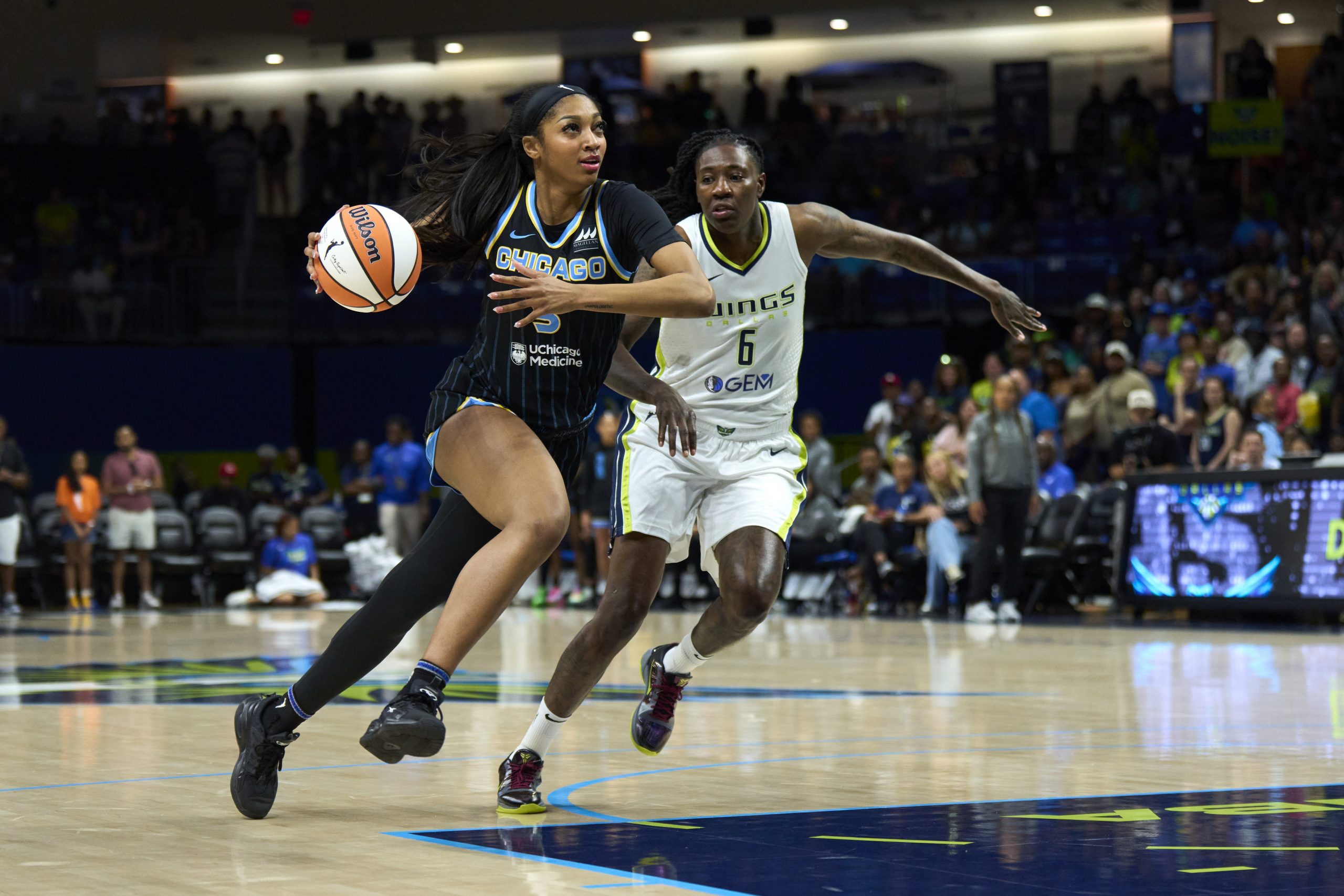 Angel Reese of the Chicago Sky drives to the basket against the Dallas Wings