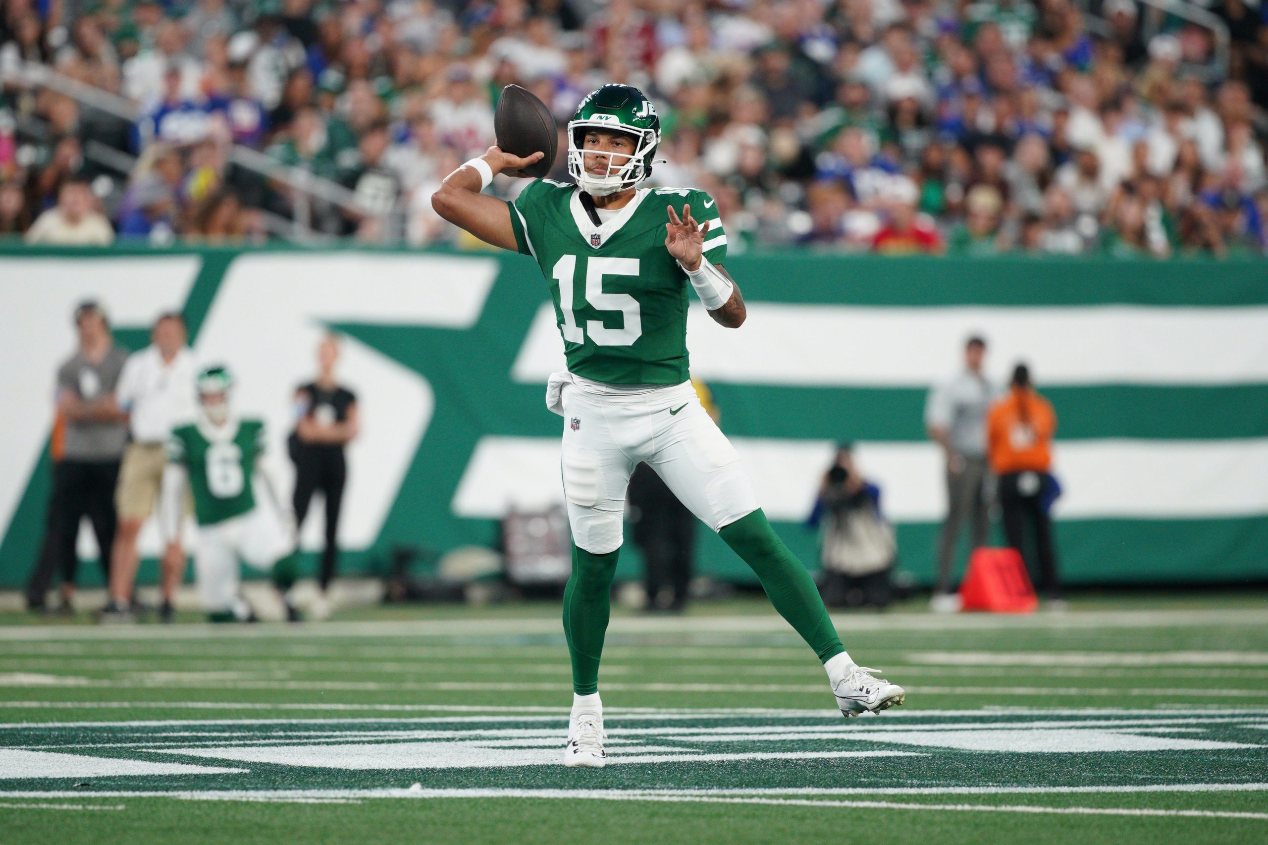 Adrian Martinez of the New York Jets throws the ball