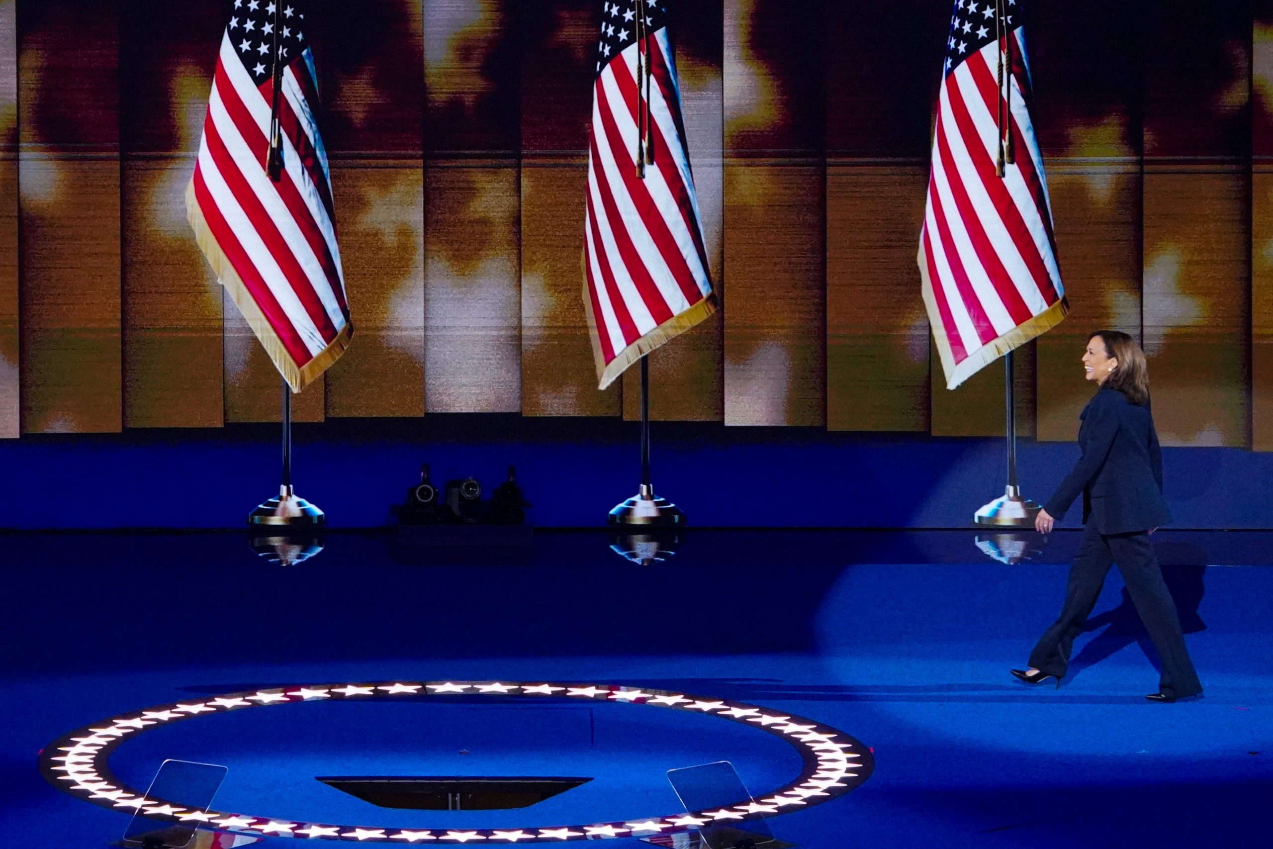 Kamala Harris strides on to the DNC stage.