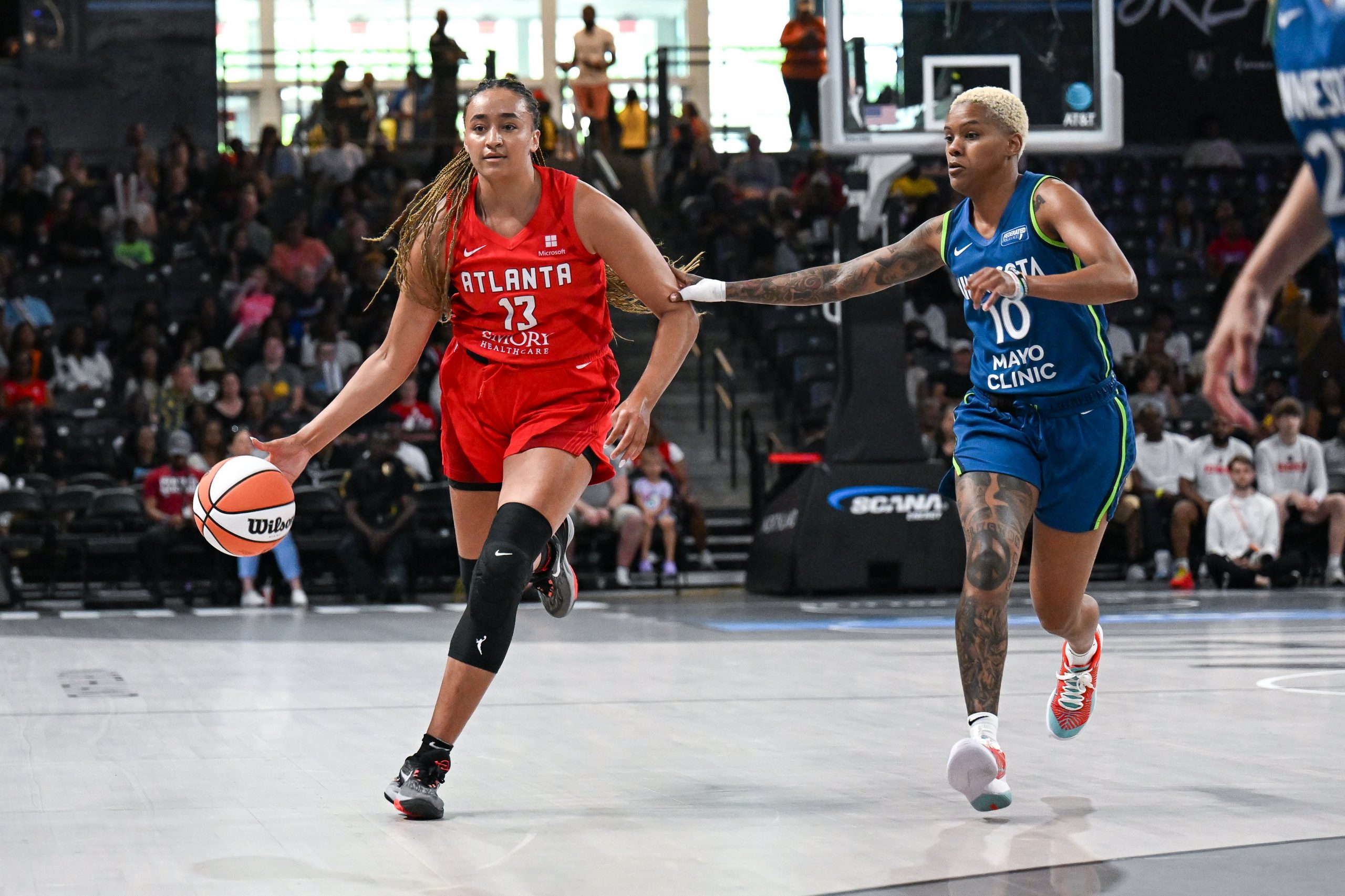 Atlanta guard Haley Jones brings the ball up the court 