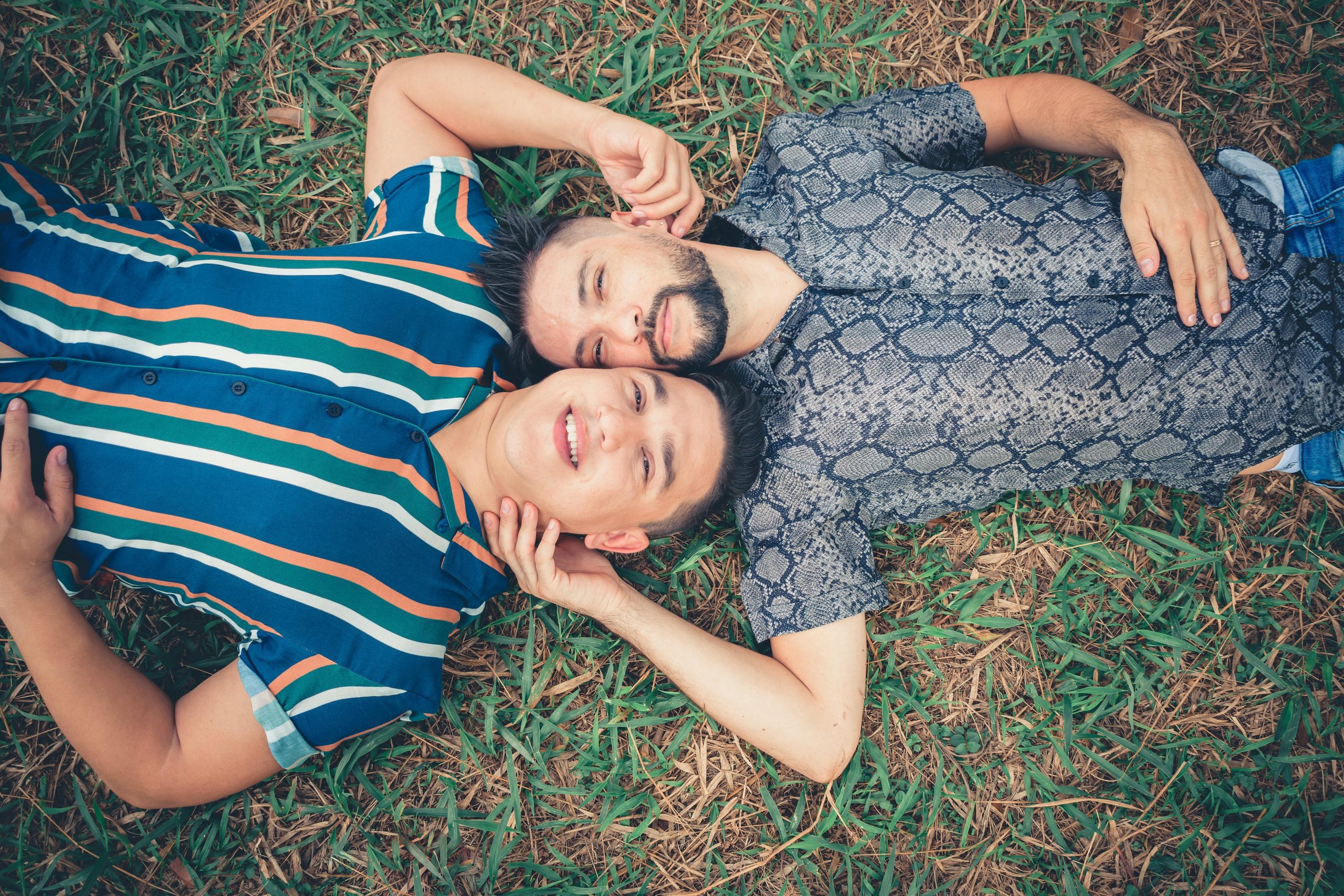 Couple lying on the grass