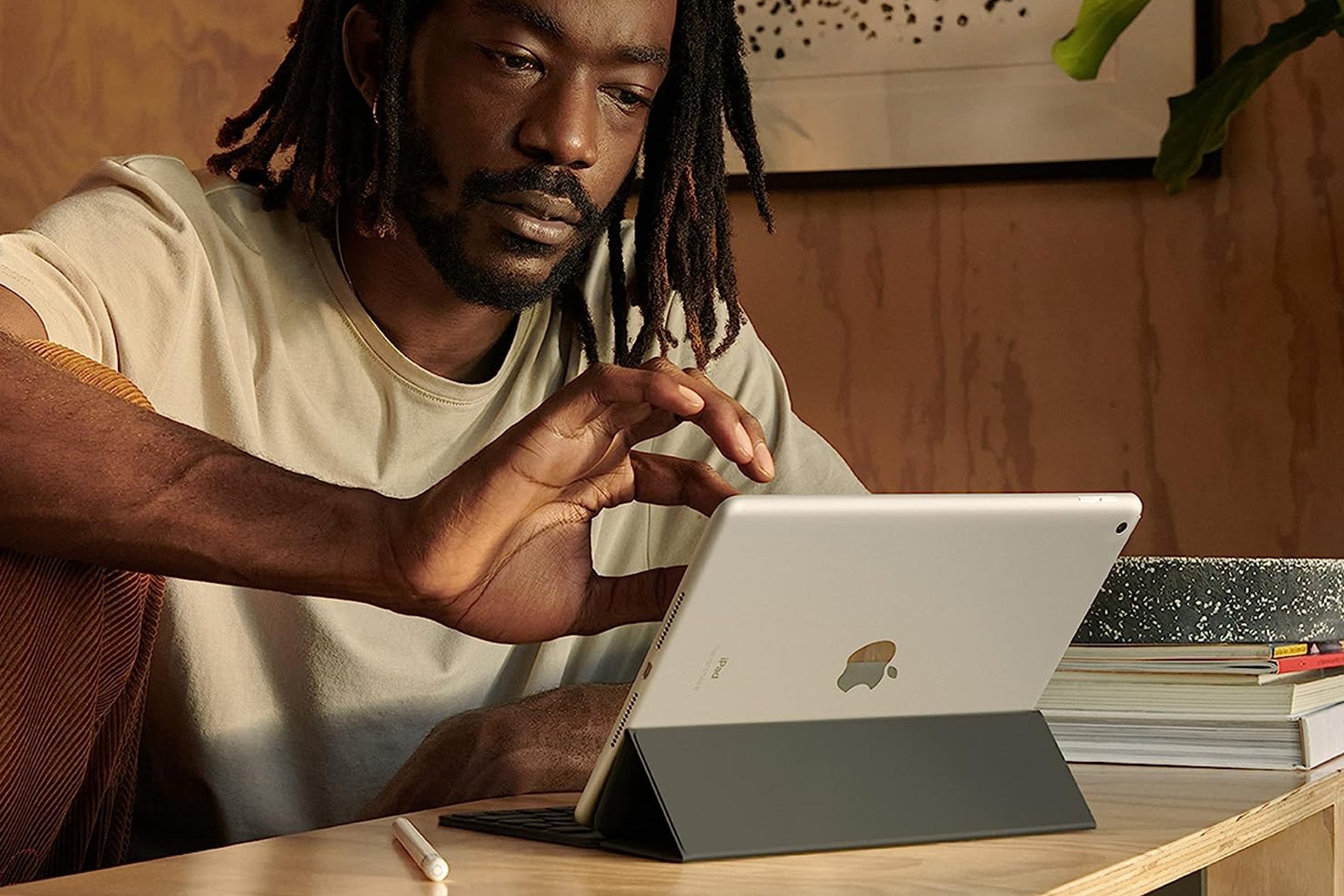 black man using Apple iPad 9th Gen