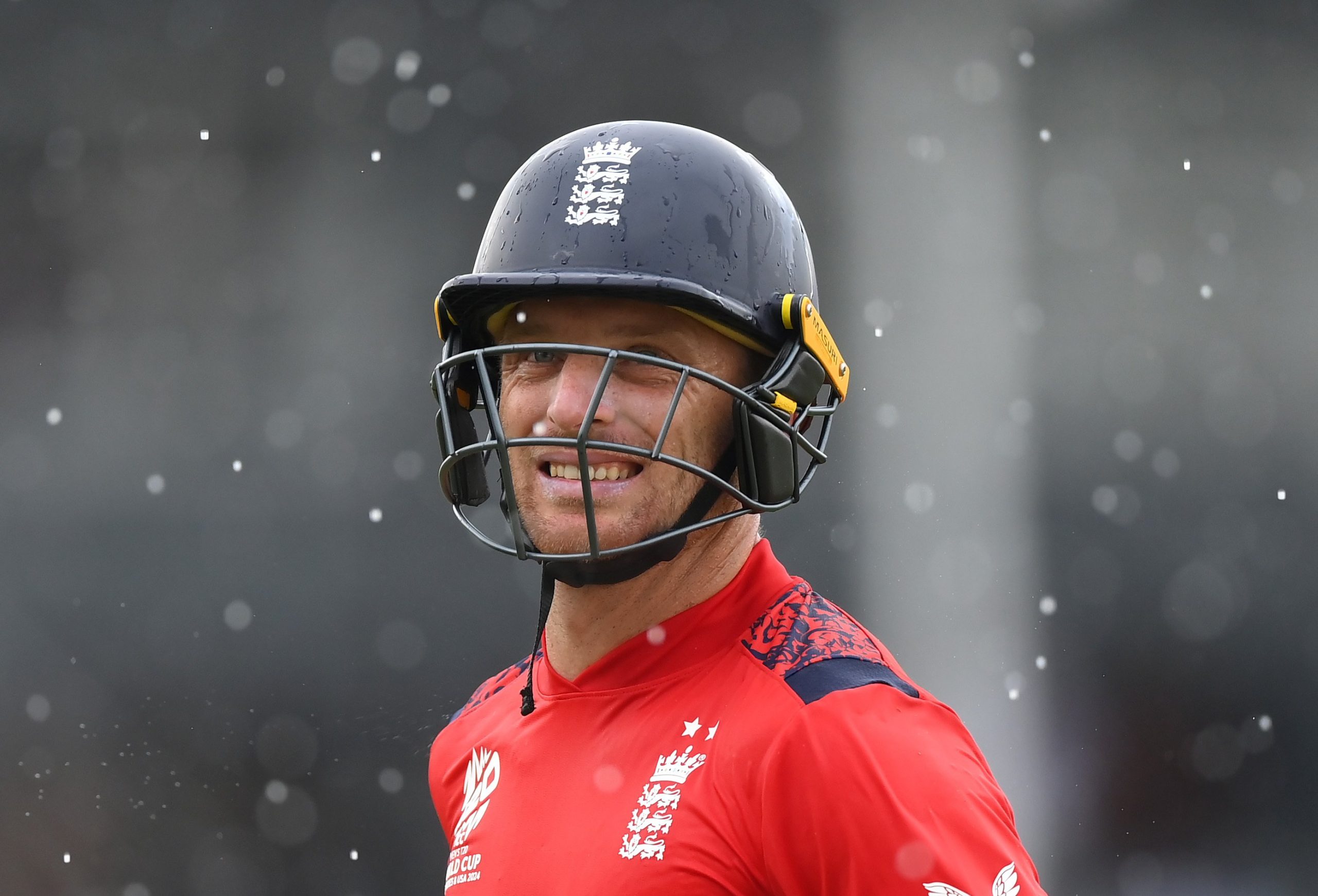 Jos Buttler of England walks off