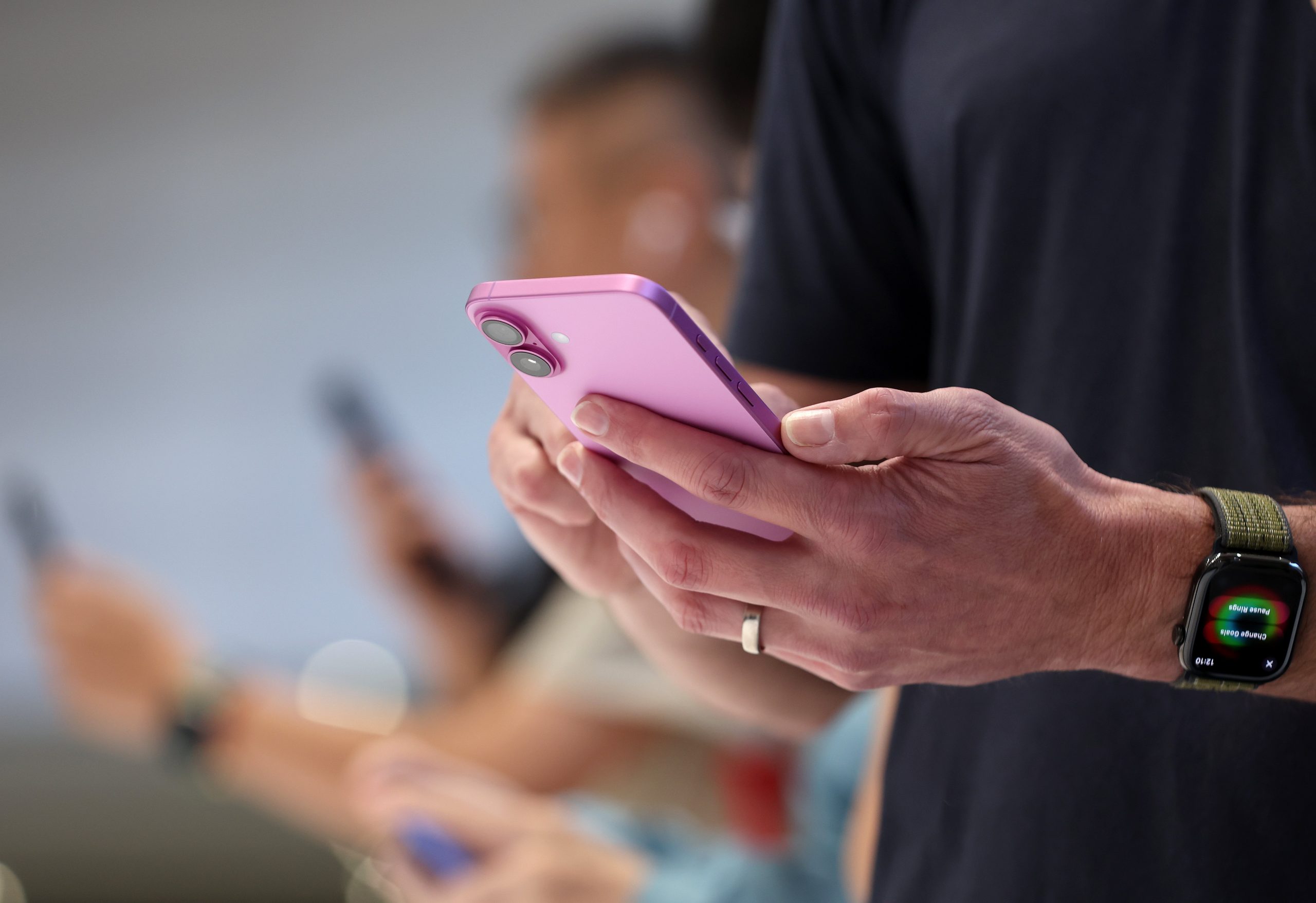 An attendee inspects the the new iPhone 16 Pro Max